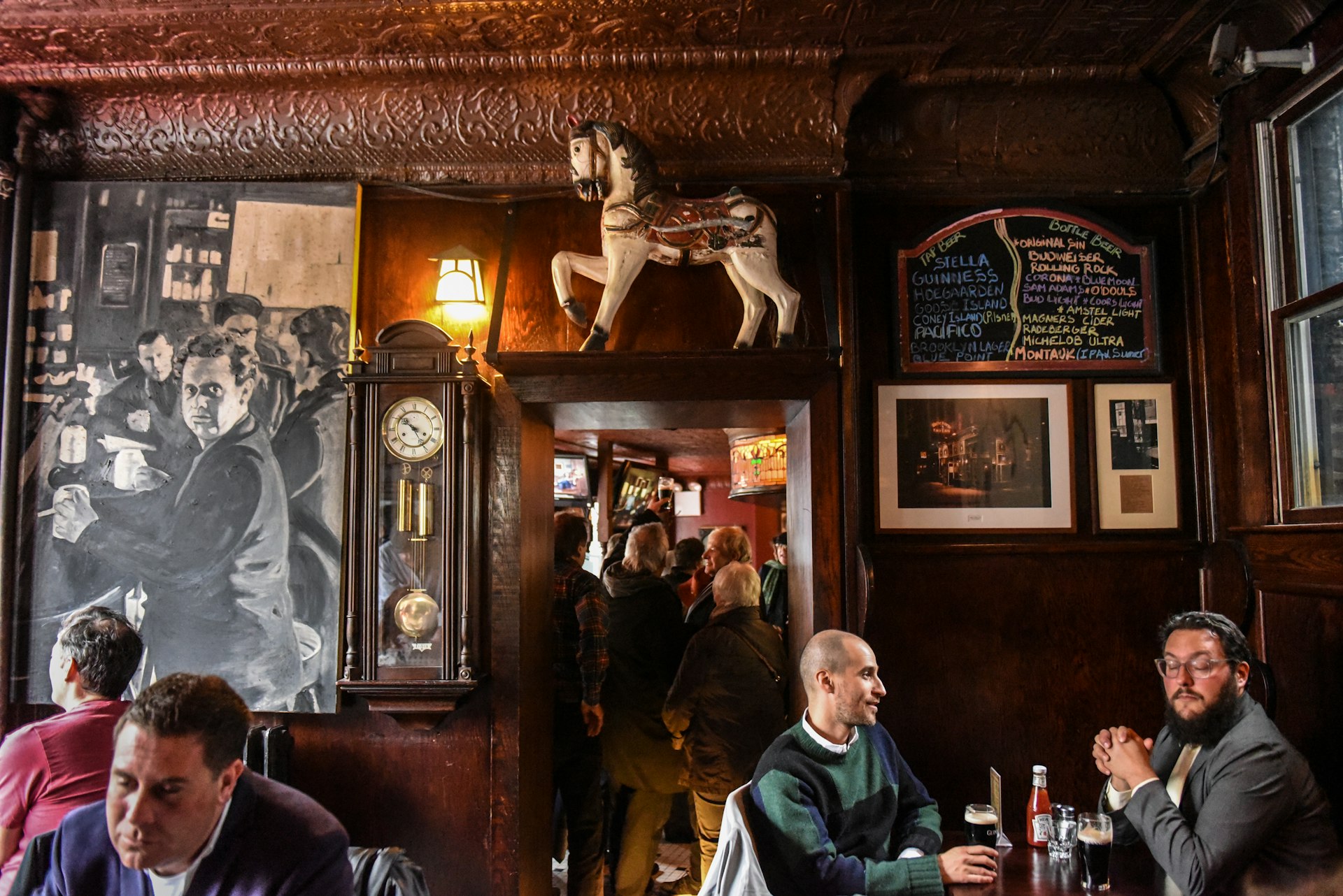Patrons at the historic White Horse Tavern, West Village, New York City, New York, USA
