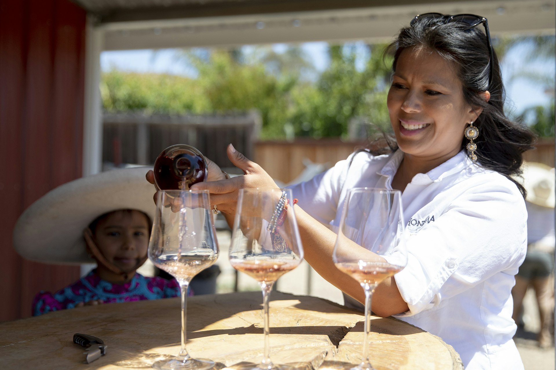 Miriam Puentes pours Paula’s Rosé at Honrama Ranch, Napa, California
