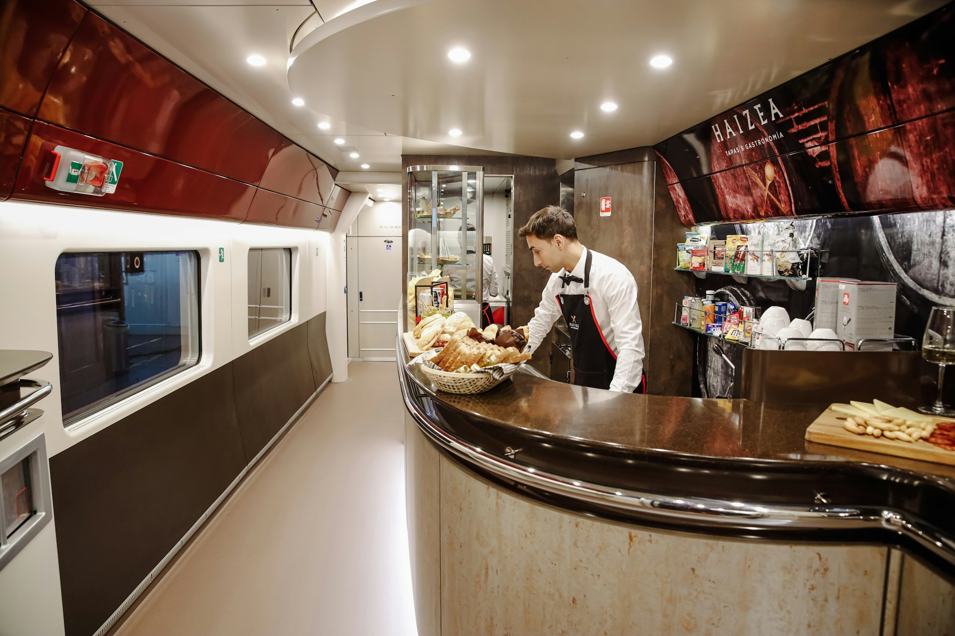 A waiter at the cafeteria inside one of the trains of operator Iryo during the company's presentation at Atocha station