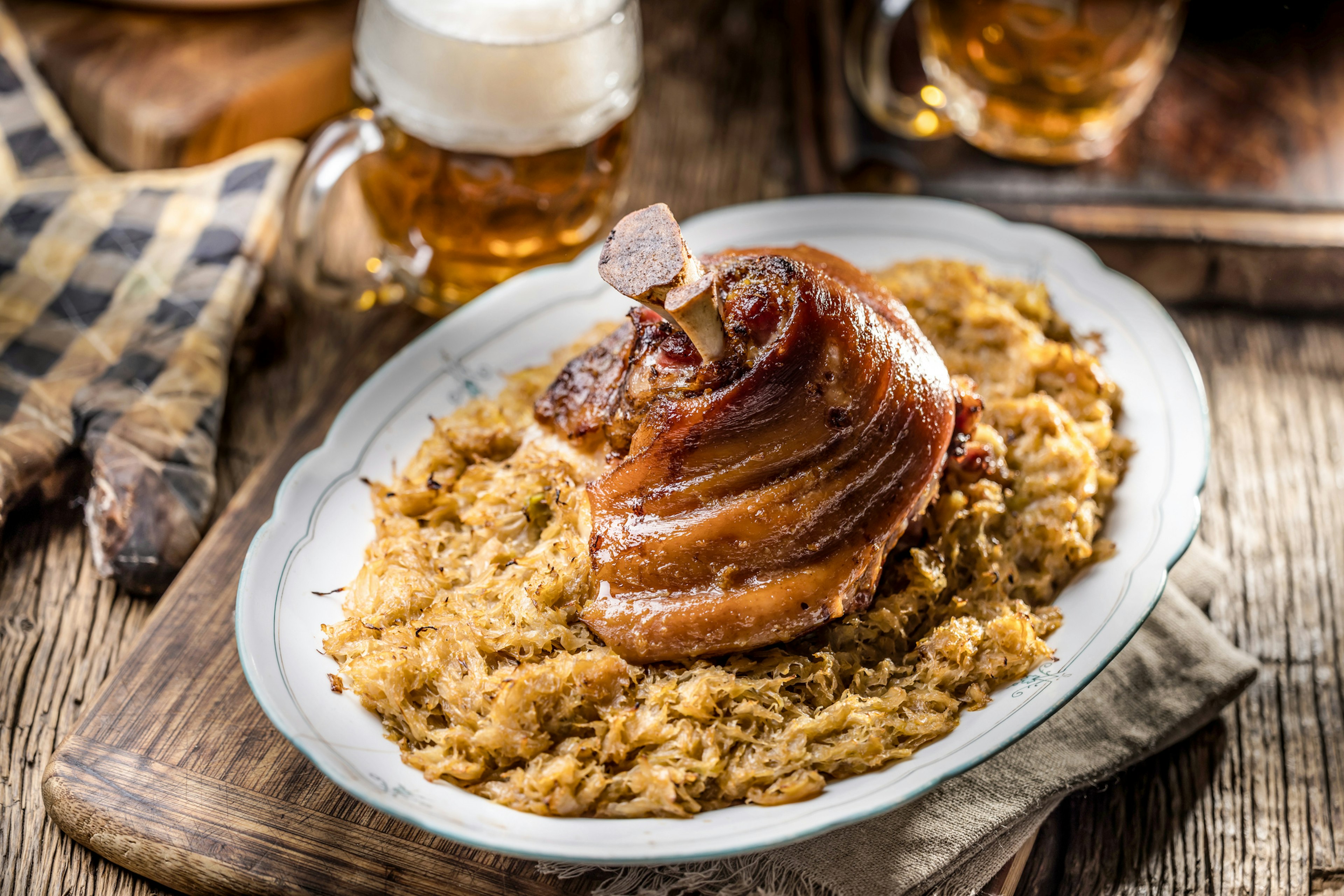 A pork knuckle on a bed of cabbage