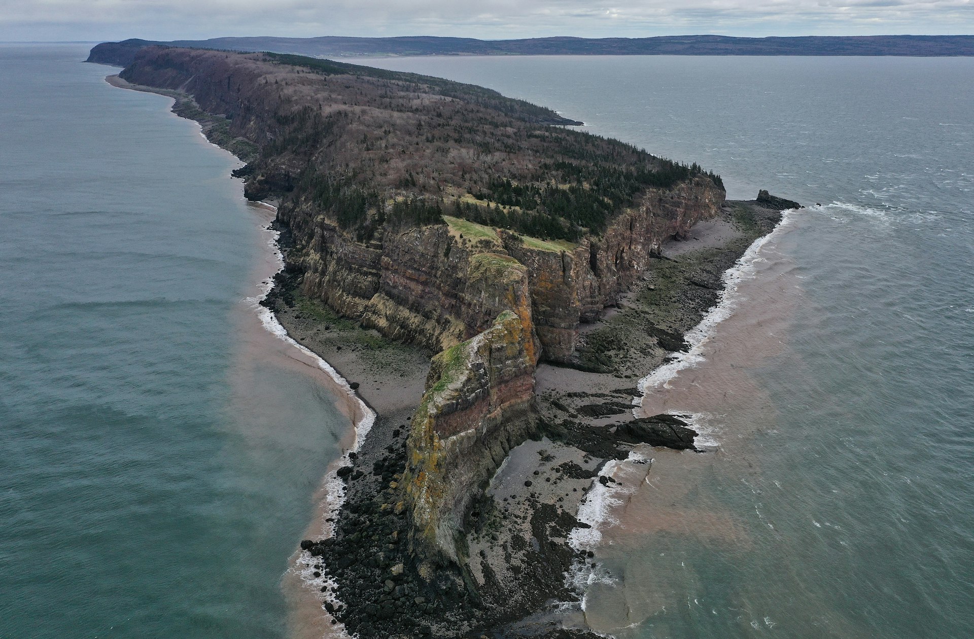 A high-angle view of seashore and cliffs against the sky, Kings County, Nova Scotia, Canada 