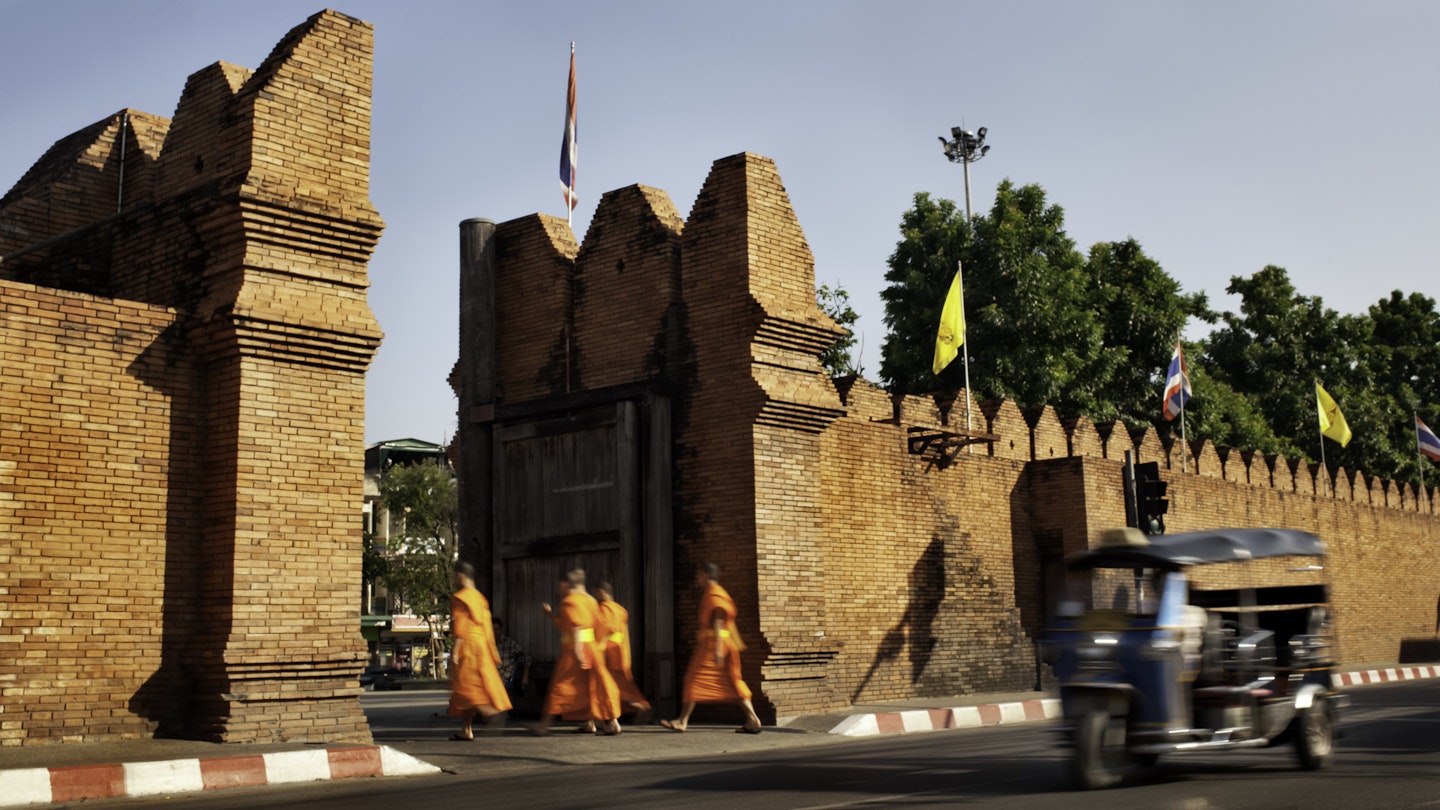 Tha Pae Gate, Chiang Mai a tuktuk and four unrecognizable young monks.
183344509
Surrounding Wall, Travel, People Traveling, Tourism, Jinrikisha, Men, East Asian Culture, Brick, Buddhism, Asian Ethnicity, Chiang Mai Province, Thailand, Transportation, Blurred Motion, Monk - Religious Occupation, People, Asia, Gate, Flag, Land Vehicle, Travel Locations, People, Transportation, Tha Pae
