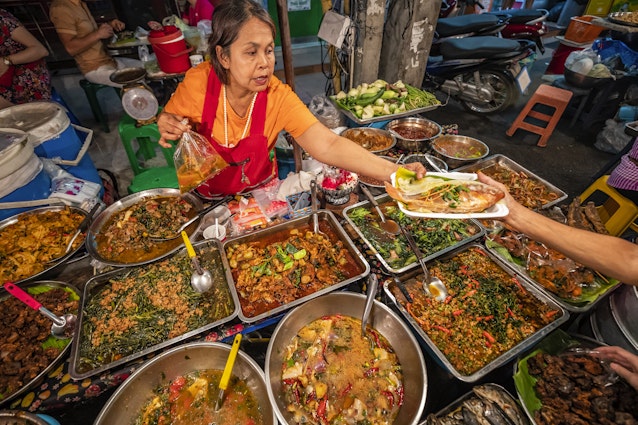 Thailand-Chiang Mai Province-Chiang Mai City-hadynyah-GettyImages-1924240006-RFC

Thai street food seller at the night market in Chiang Mai, Northern Thailand © hadynyah / Getty Images