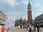 05 April 2024, Italy, Venedig: A card with the calendar for the first days of the entrance fee for Venice, held up on St. Mark's Square in front of the Campanile. Photo: Christoph Sator/dpa (Photo by Christoph Sator/picture alliance via Getty Images)
2147026686
lifestyle and leisure, ---