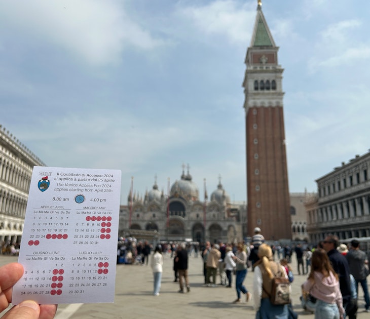 05 April 2024, Italy, Venedig: A card with the calendar for the first days of the entrance fee for Venice, held up on St. Mark's Square in front of the Campanile. Photo: Christoph Sator/dpa (Photo by Christoph Sator/picture alliance via Getty Images)
2147026686
lifestyle and leisure, ---