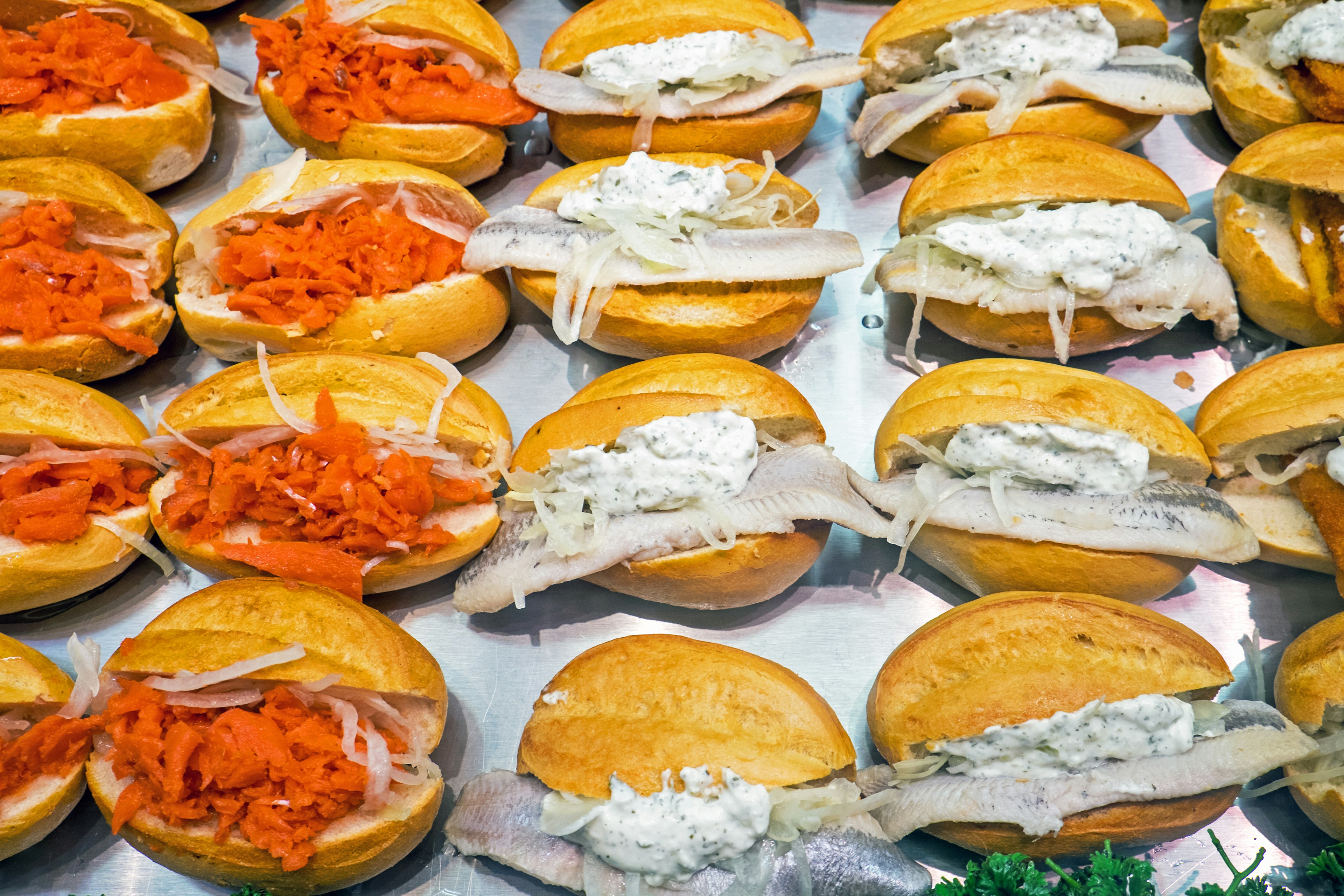 Bread rolls stuffed with fish on display on a counter