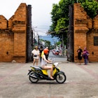 Chiang Mai, Thailand â€“ September 02, 2015: Group of tourists looking around the Thapae gate and one girl driving by them.
Chiang Mai, Thailand – September 02, 2015: Group of tourists looking around the Thapae gate and one girl driving by them.
486889596
Concrete Block, Concrete, Brownstone, Brick, Old Town, Chiang Mai Province, Thailand, Journey, Local Landmark, International Landmark, Famous Place, Tourist, Asia, Gate, Paver Brick, Quoin, Thapae
Thailand-Chiang Mai Province-Chiang Mai City-HoneyBee201306-GettyImages-486889596-RFE
Chiang Mai, Thailand – September 02, 2015: Group of tourists looking around the Thapae gate and one girl riding by on a moped © HoneyBee201306 / Getty Images