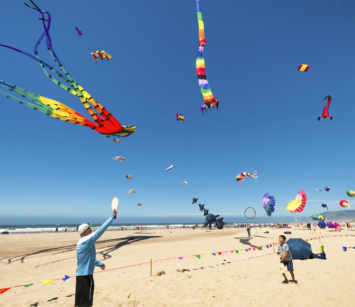 Lincoln City, Oregon,USA- June 26, 2016: Annual kite festival in Linclon City on the Oregon Coast.  A man and boy play with paddles and ball on sandy beach under a sky full of kites.
546008220
Editorial, Boys, Men, Coastline, Playing, Fun, Hat, Yellow, Red, Purple, Pink Color, Orange Color, Green Color, Blue, Sport, Outdoors, People, Oregon, Pacific Northwest, Sand, Beach, Sky, Wind, Sea, Wave, Water, Flag, Traditional Festival, Kite - Toy, Ball, Shorts, Lincoln City - Oregon