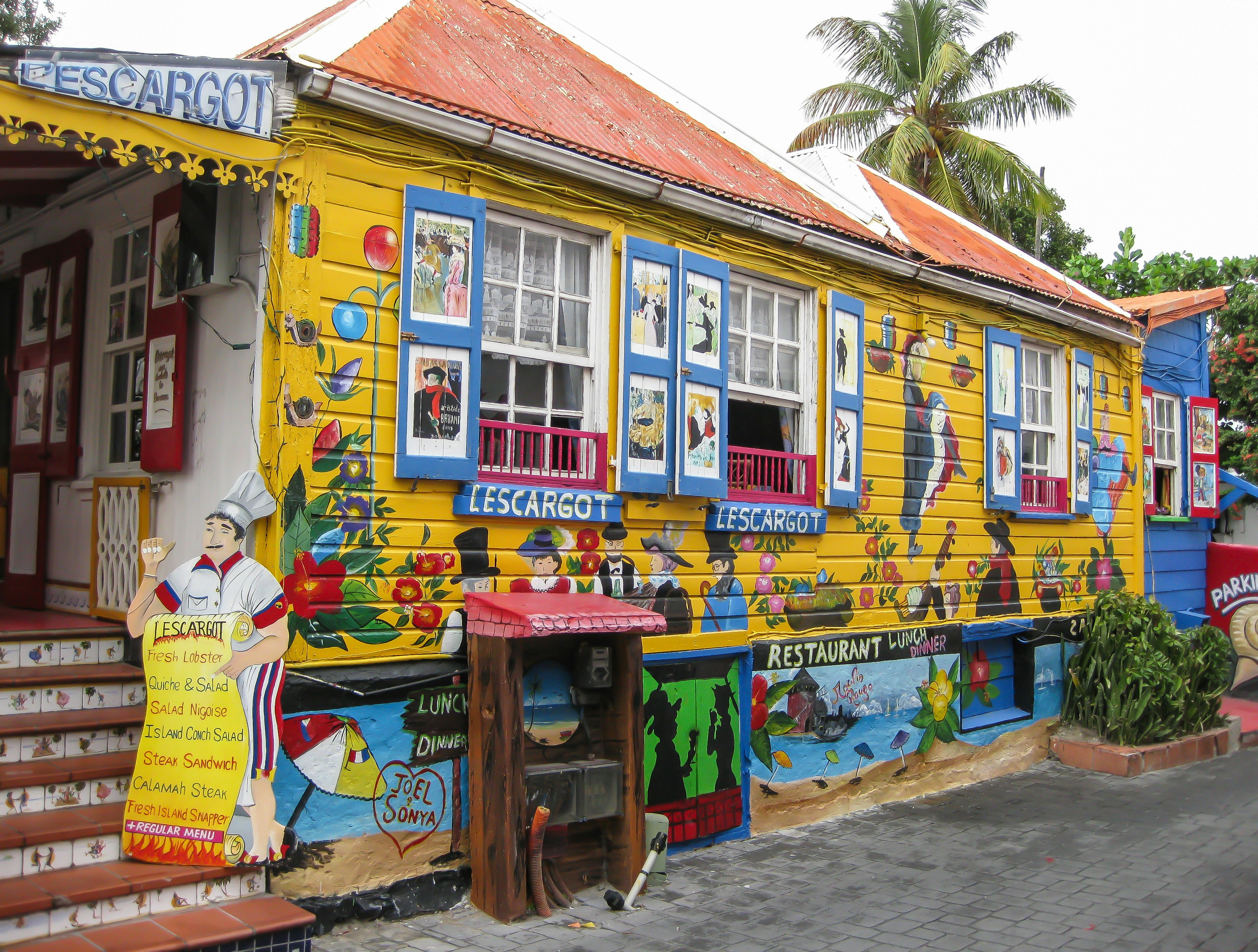 A colorful restaurant called L'Escargot (the snail serves French food in Philispburg near many popular shopping areas.