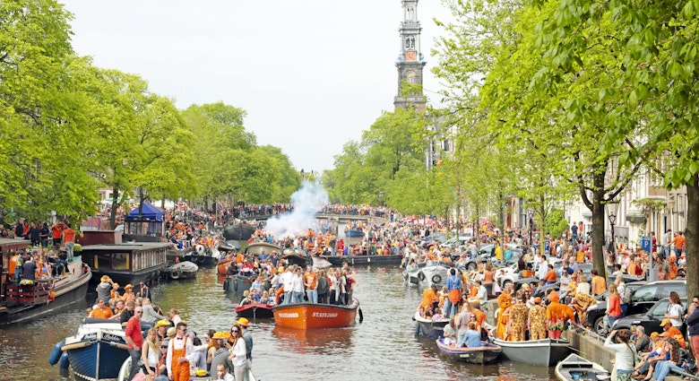 Amsterdam The Netherlands - April 26, 2014: Amsterdam canals full of boats and people in orange at the Prinsengracht during the celebration of kings day on April 26, 2014 in Amsterdam, The Netherlands
520265305
Capital Cities, Holiday, Tourist, Passenger Craft, Built Structure, Holiday - Event, Looking At View, Cruise Ship, King - Royal Person, Party - Social Event, Queen, Medieval, King's Day, Cityscape, Architecture, King's Day - Netherlands, April, city-view, Party, Amsterdam, City, Canal, Horizontal, Queen - Royal Person, Water, Canal House, Netherlands, Celebration, House, Day, Building Exterior, Cruise - Vacation, King, Residential Building, People, Photography, Queens-day, City-scenic, Outdoors, River, Nautical Vessel