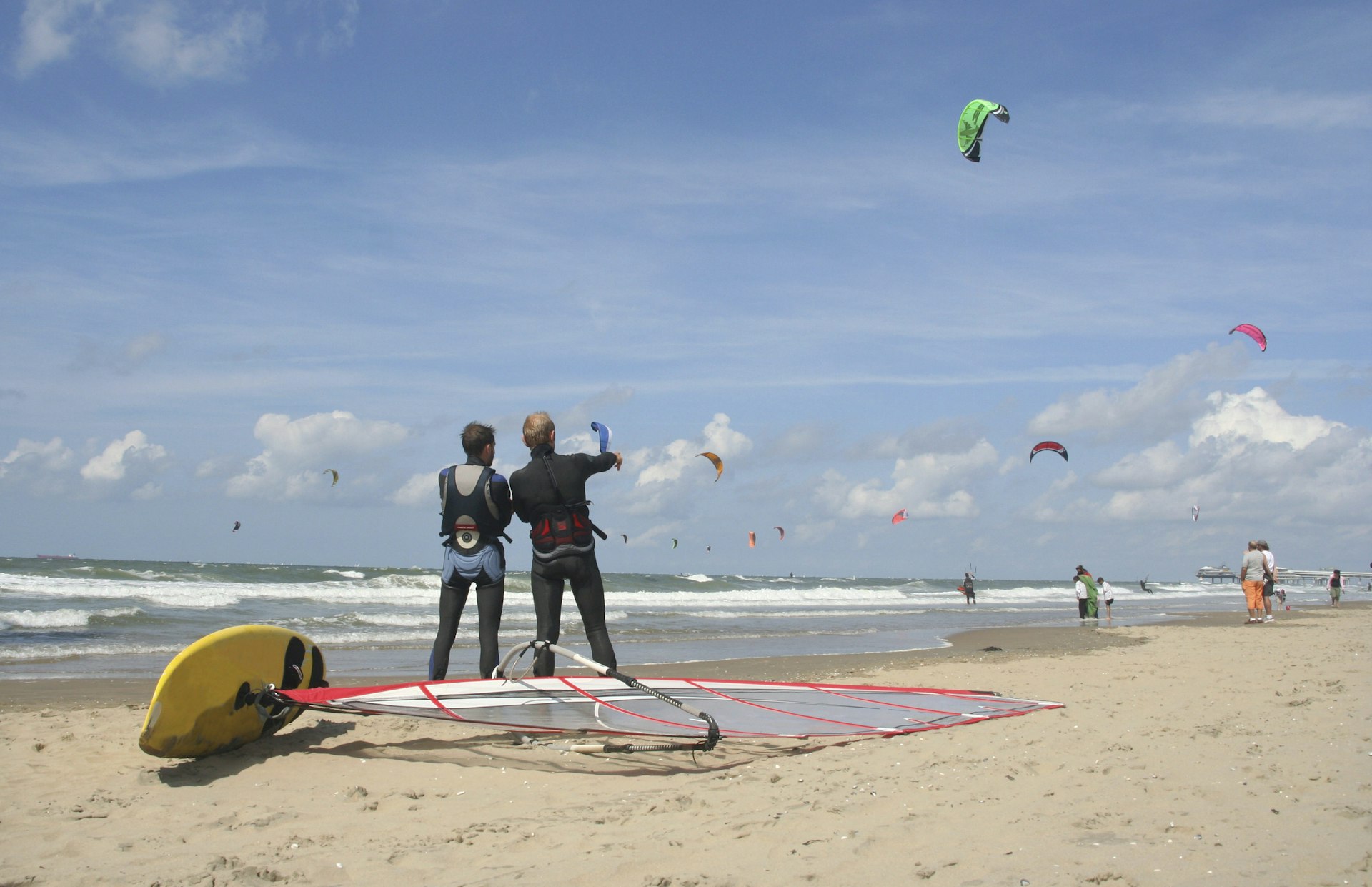 Kitesurfers and sailboarders on Scheveningen Beach.