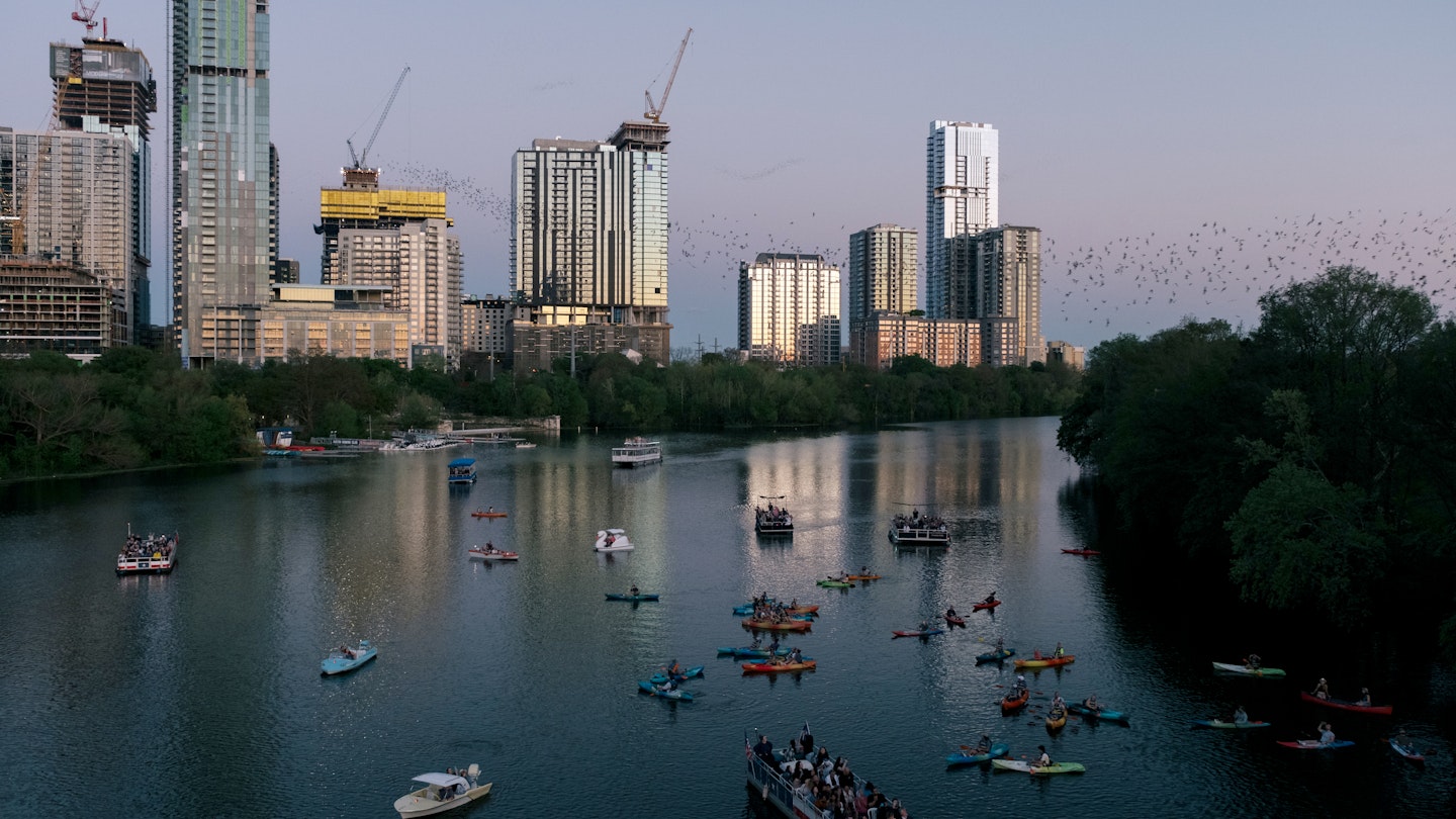 Congress Bats and Kayaking in Austin, TX.

Boat,  City,  Cityscape,  Construction,  Construction Crane,  High Rise,  Metropolis,  Office Building,  Outdoors,  Person,  Urban,  Vehicle,  Water,  Watercraft,  Waterfront