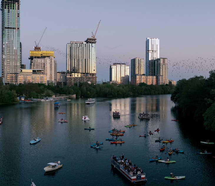 Congress Bats and Kayaking in Austin, TX.

Boat,  City,  Cityscape,  Construction,  Construction Crane,  High Rise,  Metropolis,  Office Building,  Outdoors,  Person,  Urban,  Vehicle,  Water,  Watercraft,  Waterfront