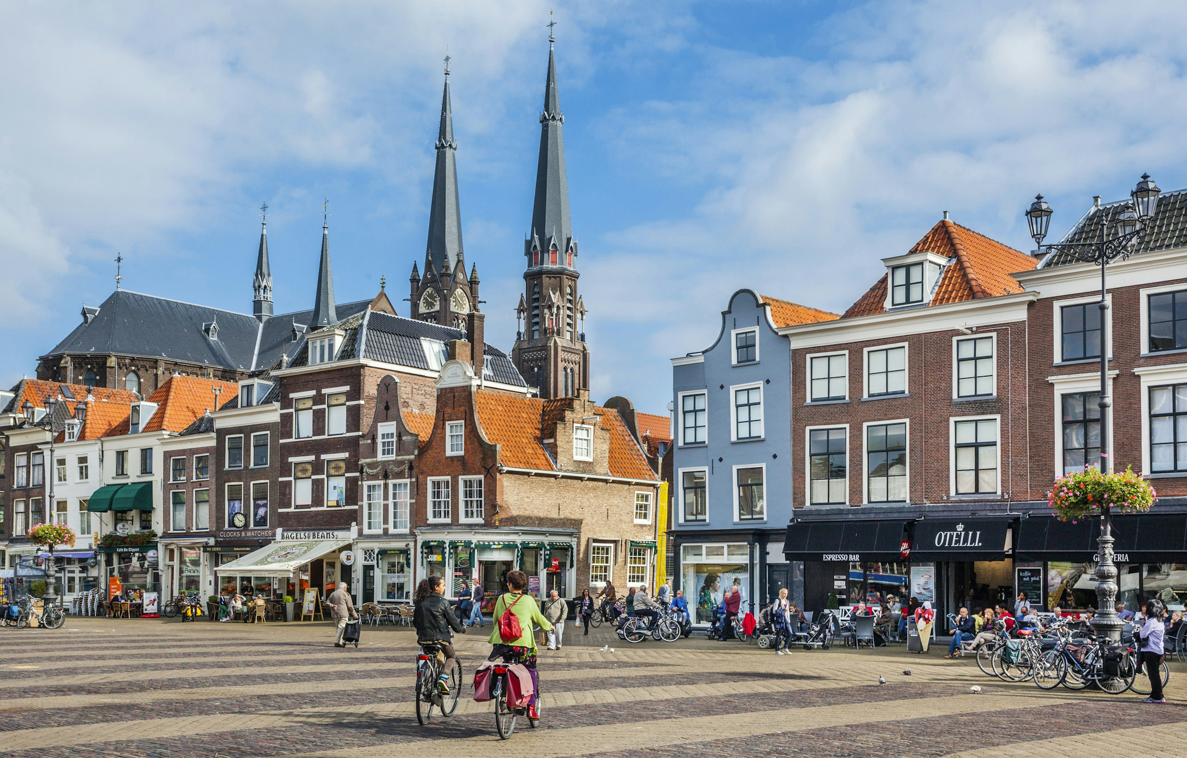 Delft market square with the spires of Maria van Jesse Church in the background