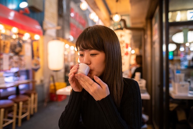 Young female friends visiting some major places in Tokyo to enjoy Christmas lights and good food and drink after work.