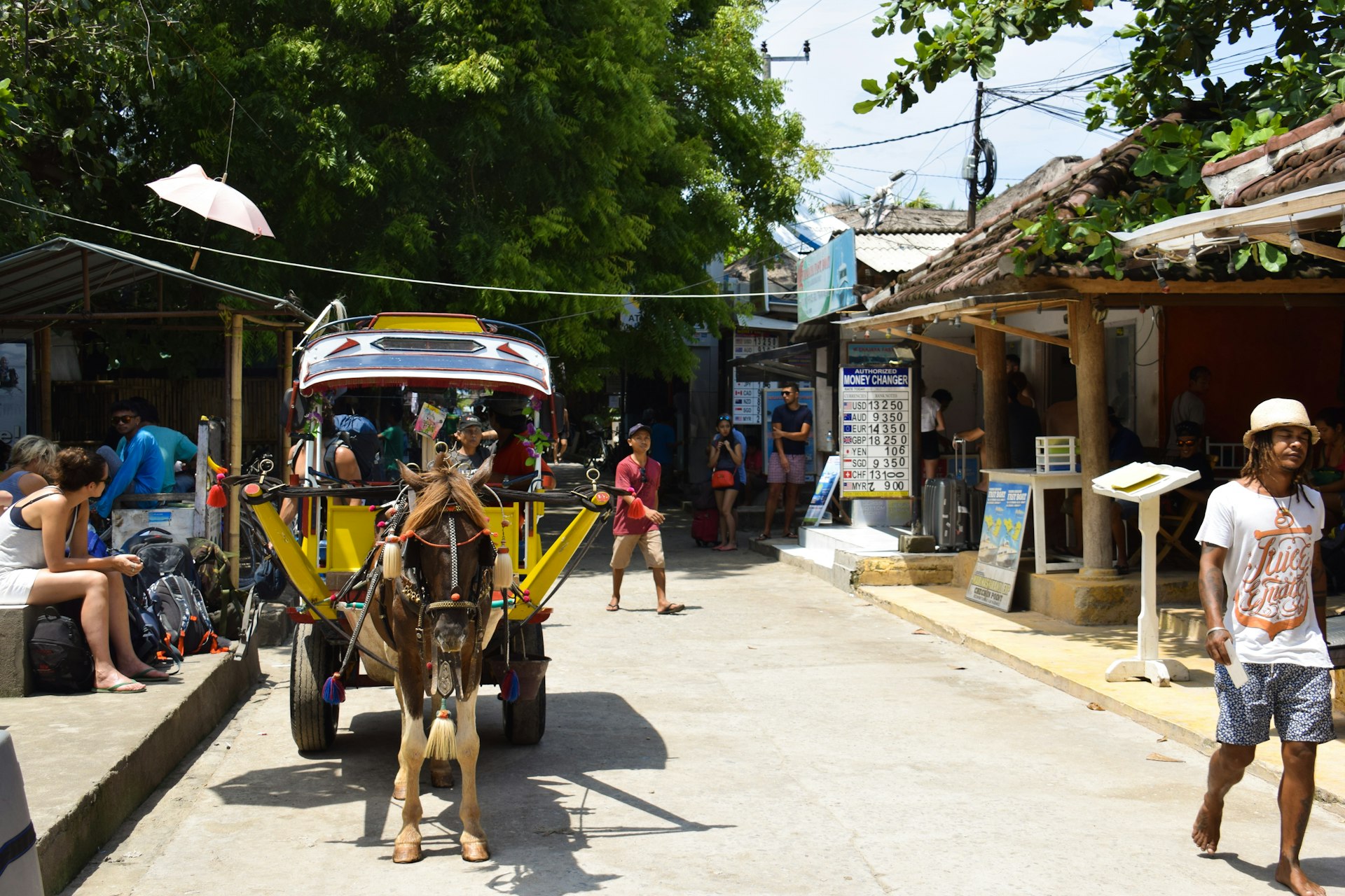 people waiting for a horse drawn cart on Gili Islands indonesia