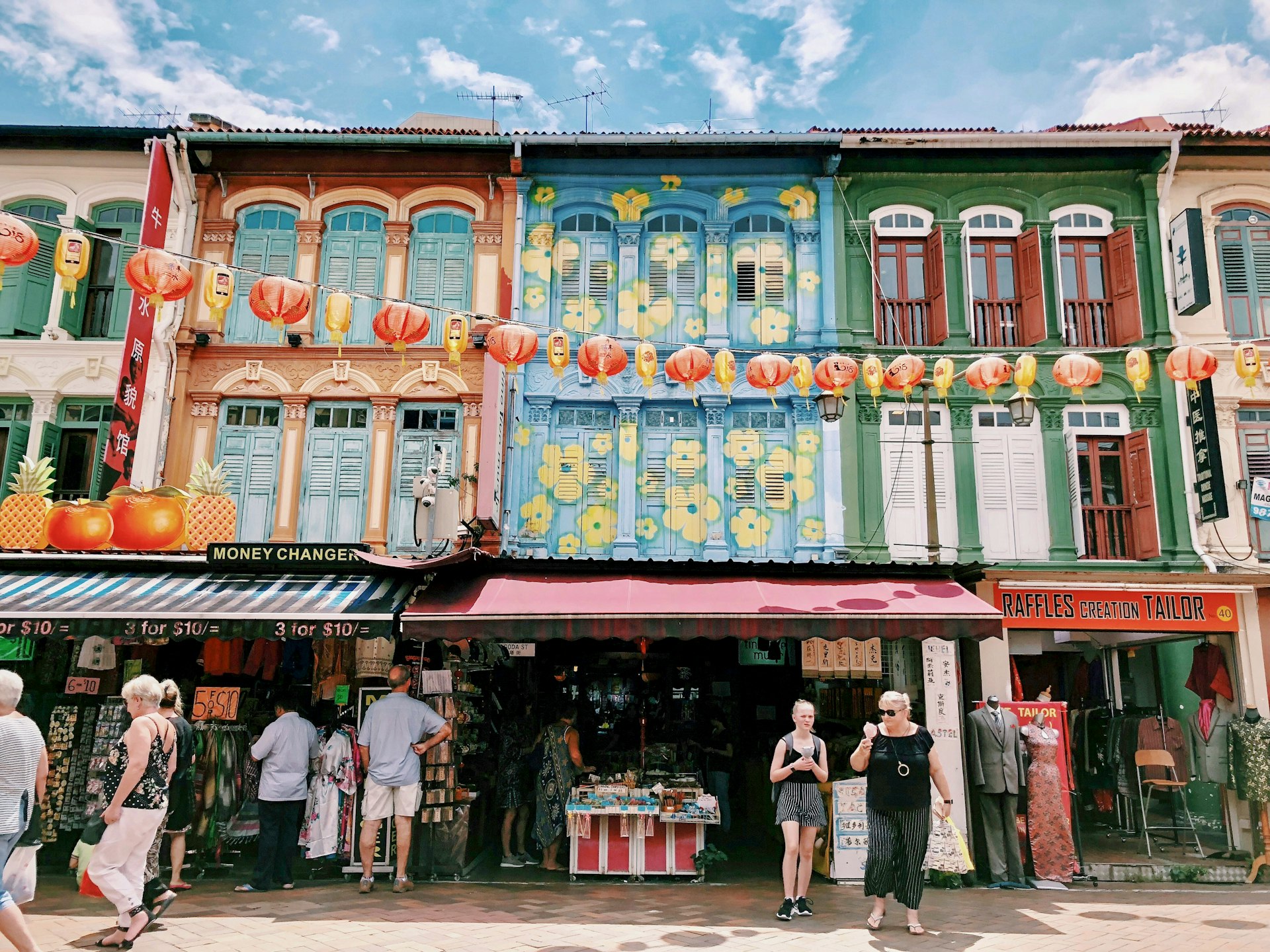 Old street front in Singapore's Chinatown with tourists