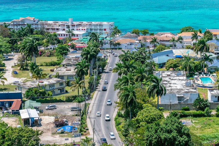 Montego Bay, Jamaica - March 27 2015: Aerial/Drone view near coastline in tourism resort city of Montego Bay, Jamaica. Turquoise ocean water along the coast of tropical Caribbean island.; Shutterstock ID 1157128060; GL: 65050; netsuite: Online ed; full: Jamaica getting around; name: Claire N
1157128060