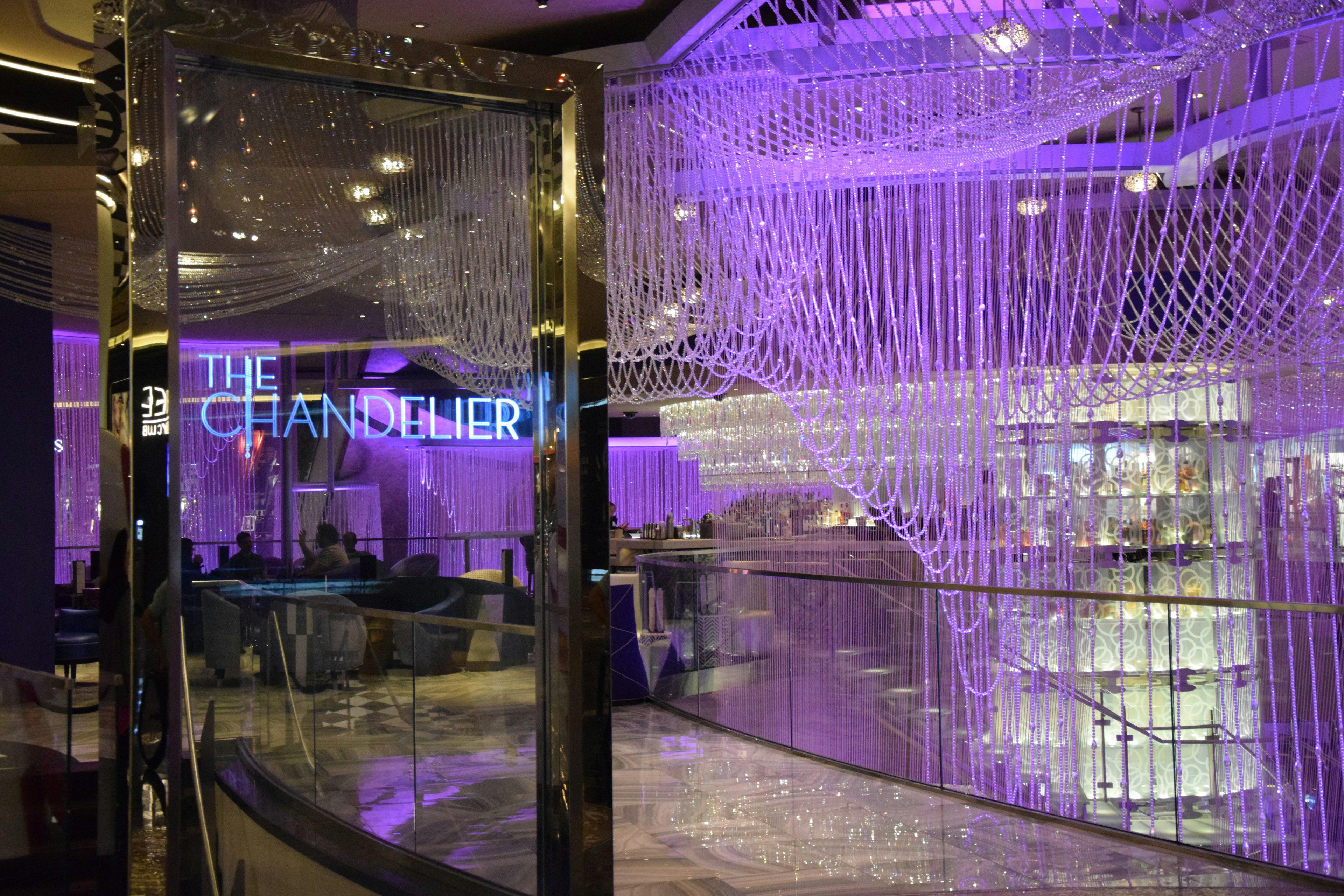 A bar decorated with lots of hanging lights