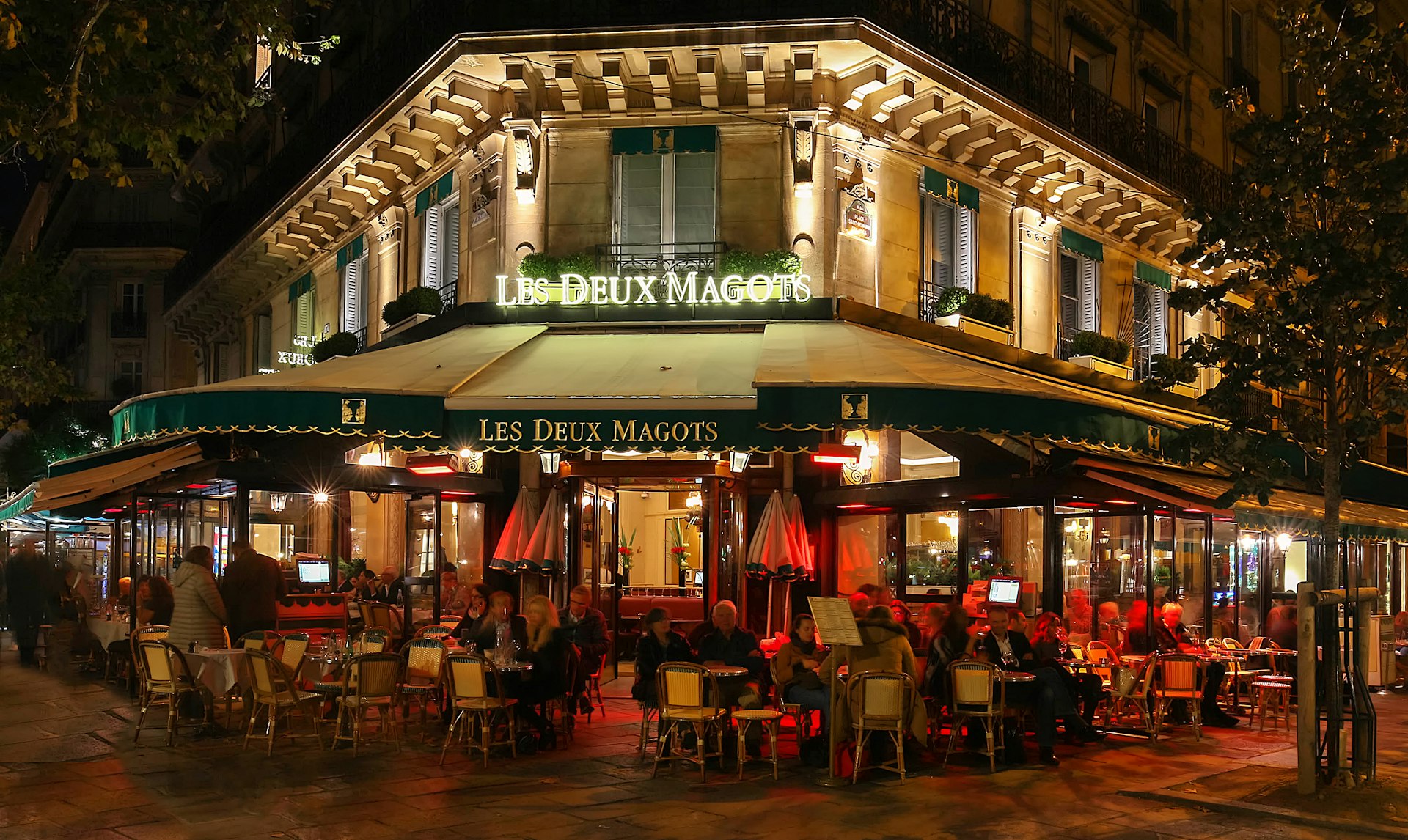 People dining at the famous cafe Les Deux Magots, Blvd St-Germain, Paris, France