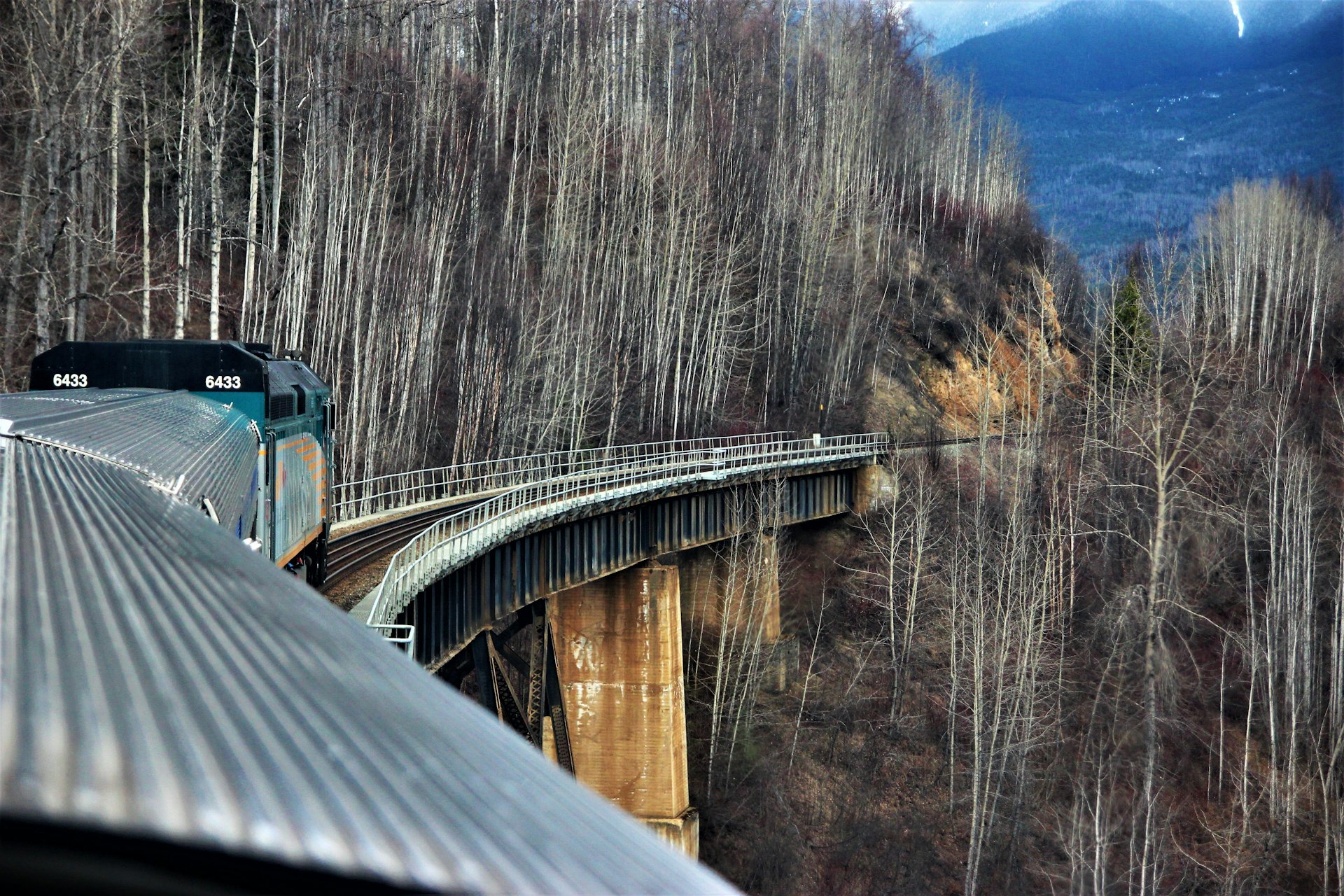 A Via Rail train crossing a bridge between Jasper and Prince Rupert, Canada