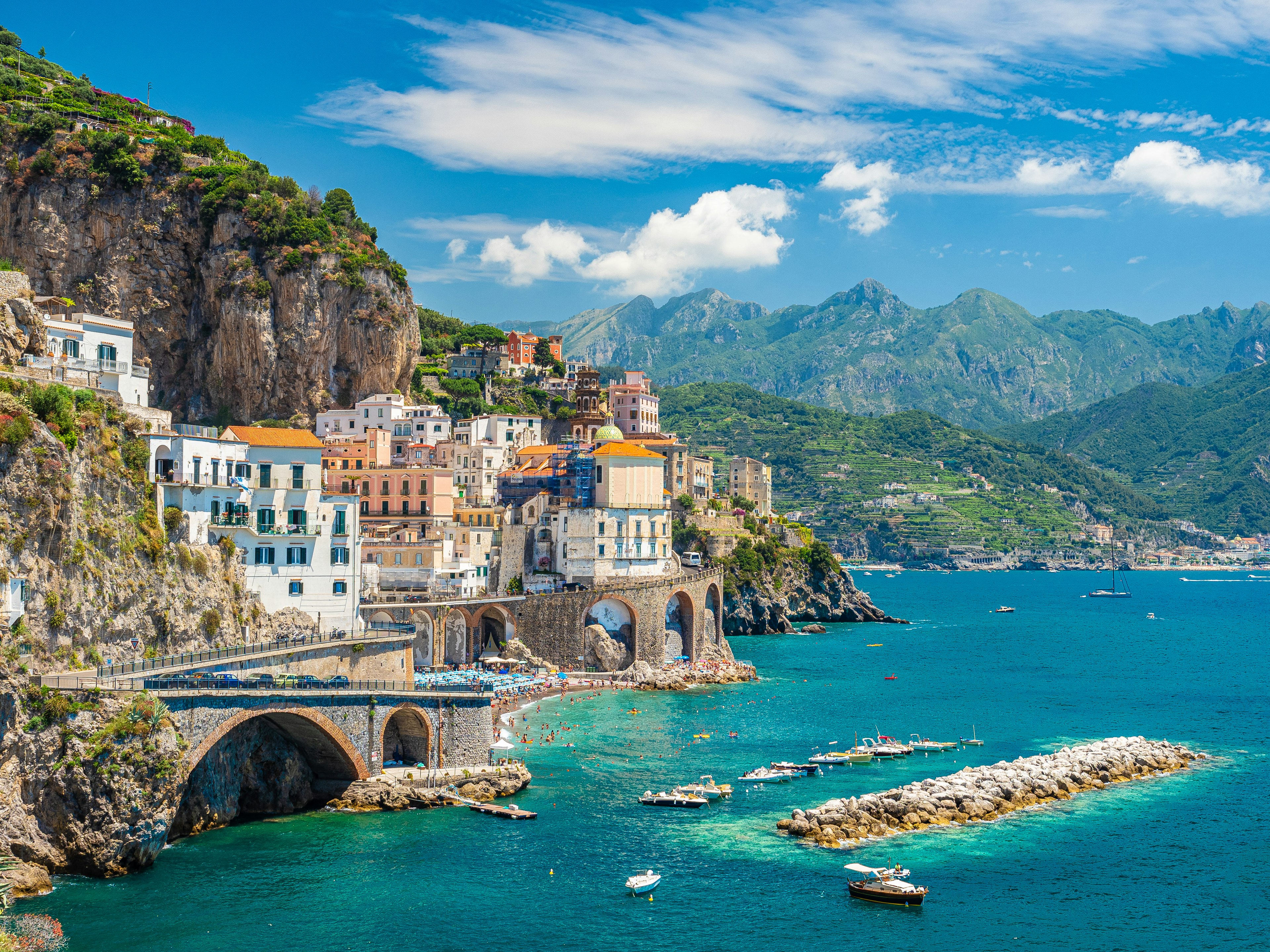 A summer's day in a small seaside town built into the side of a cliff