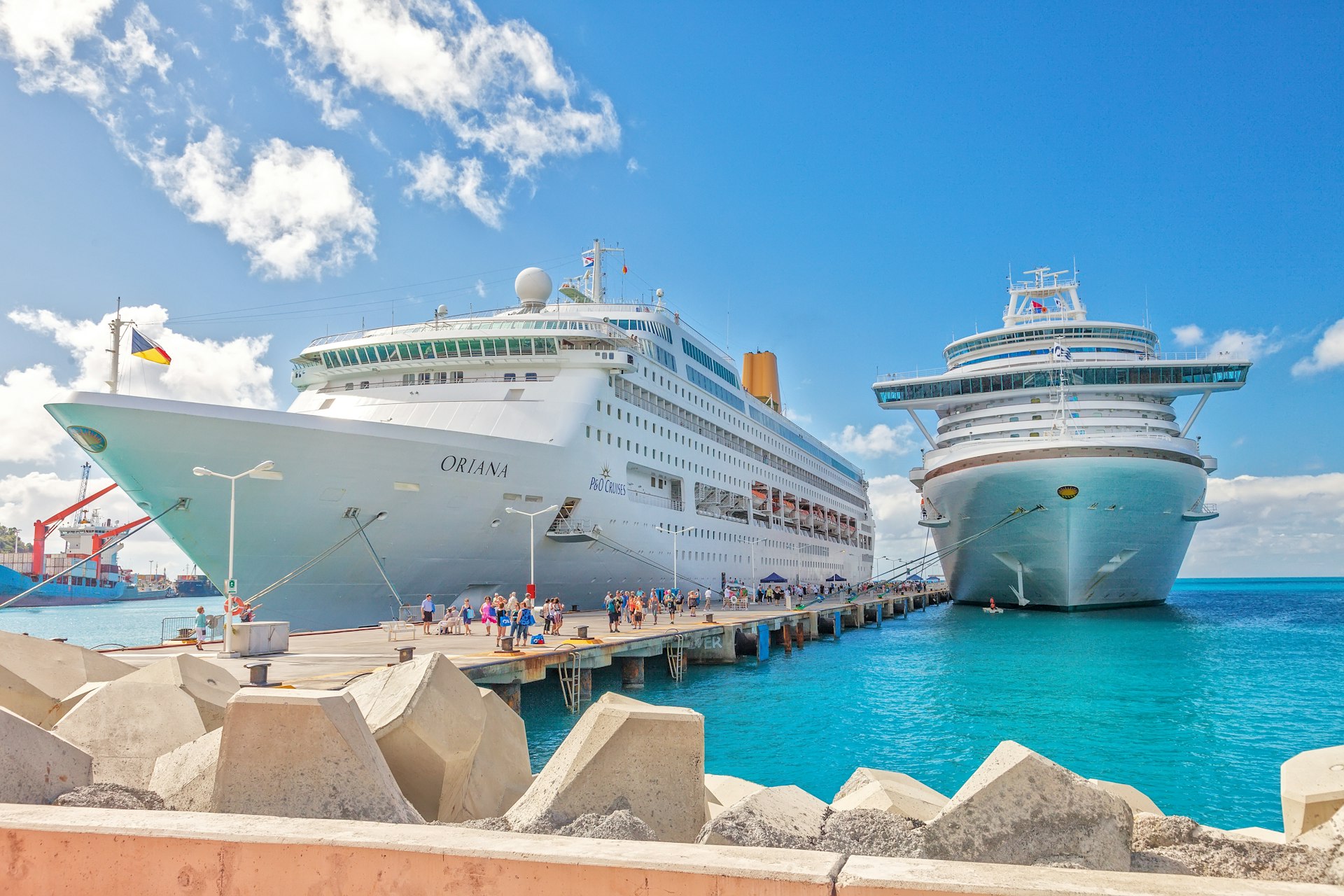 Cruise ships docked at pier on the Dutch side of St. Maarten. Passengers wanting to go to town are tendered to the smaller Hodge Pier in Philipsburg.