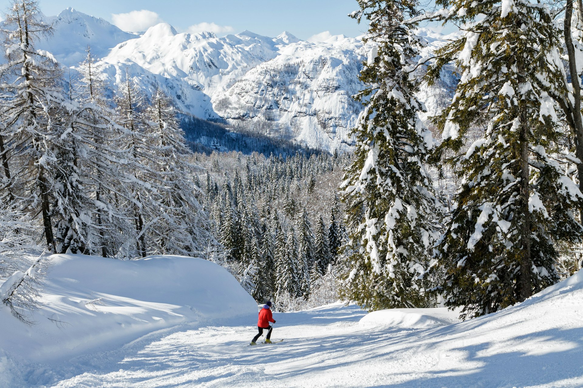 A skier descends a mountain in the Julian Alps, Slovenia