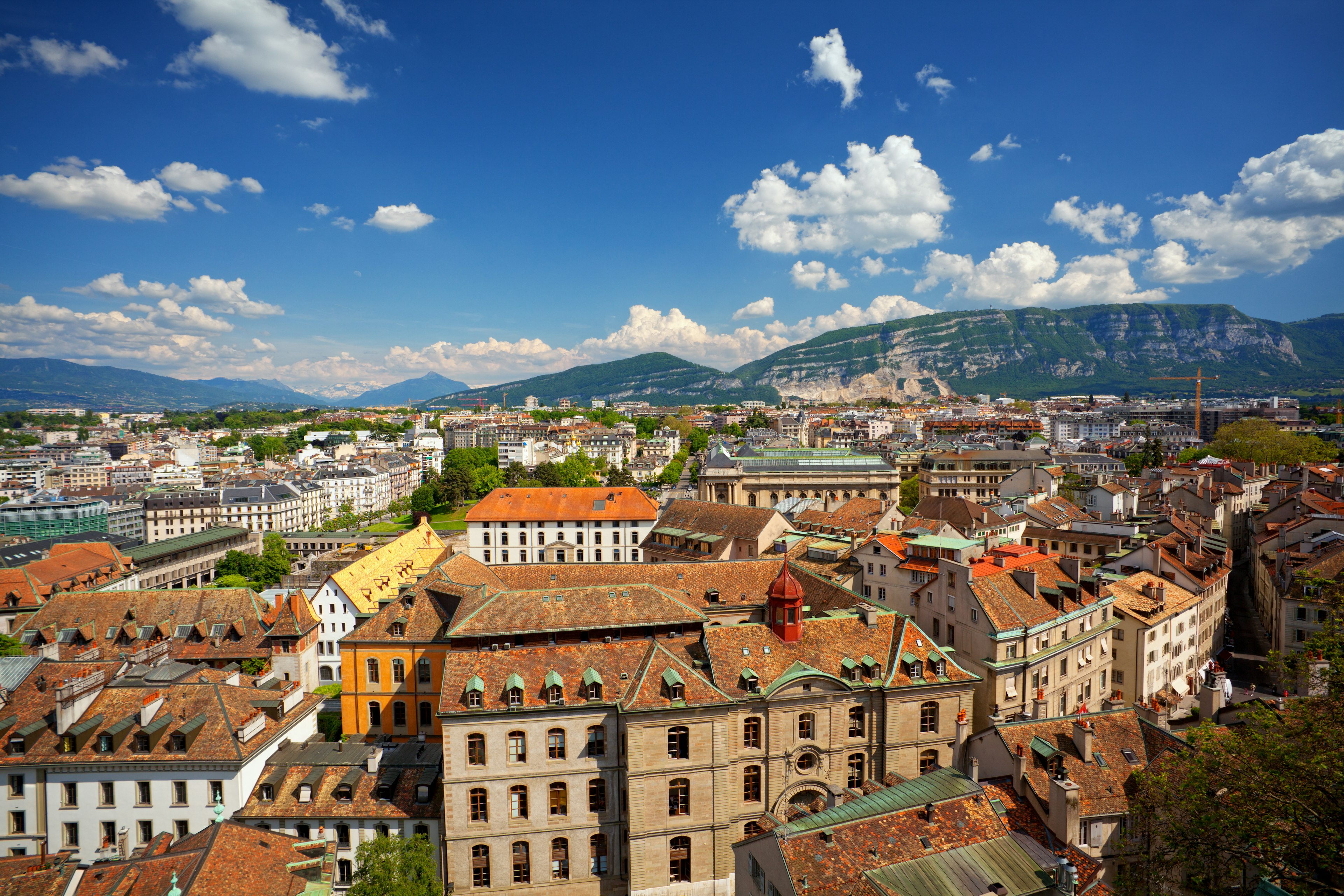 Aerial view of Geneva Old Town from St. Pierre Cathedral with Mt. Saleve on background