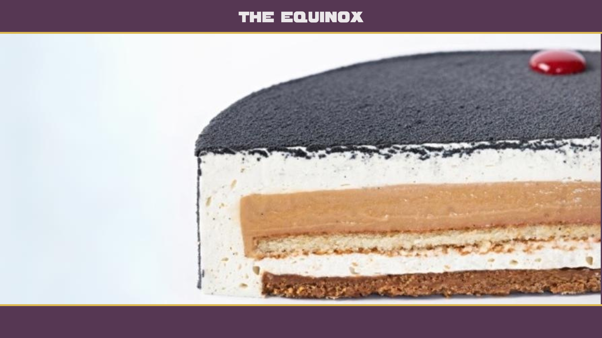 An Equinox pastry split in half to showcase the biscuit, caramel center