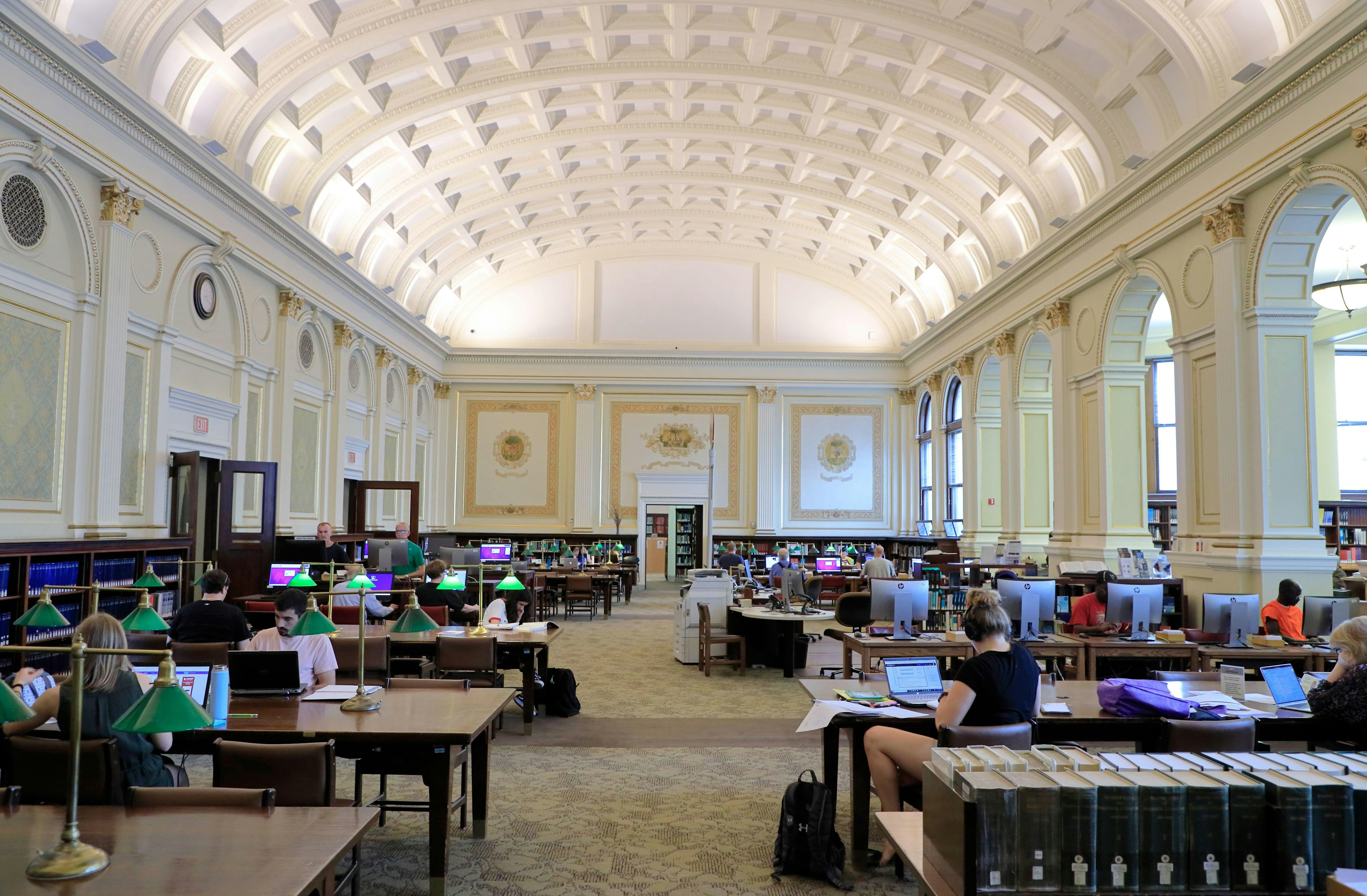 People sit at tables in the main reading room of the Carnegie Library of Pittsburgh, Oakland