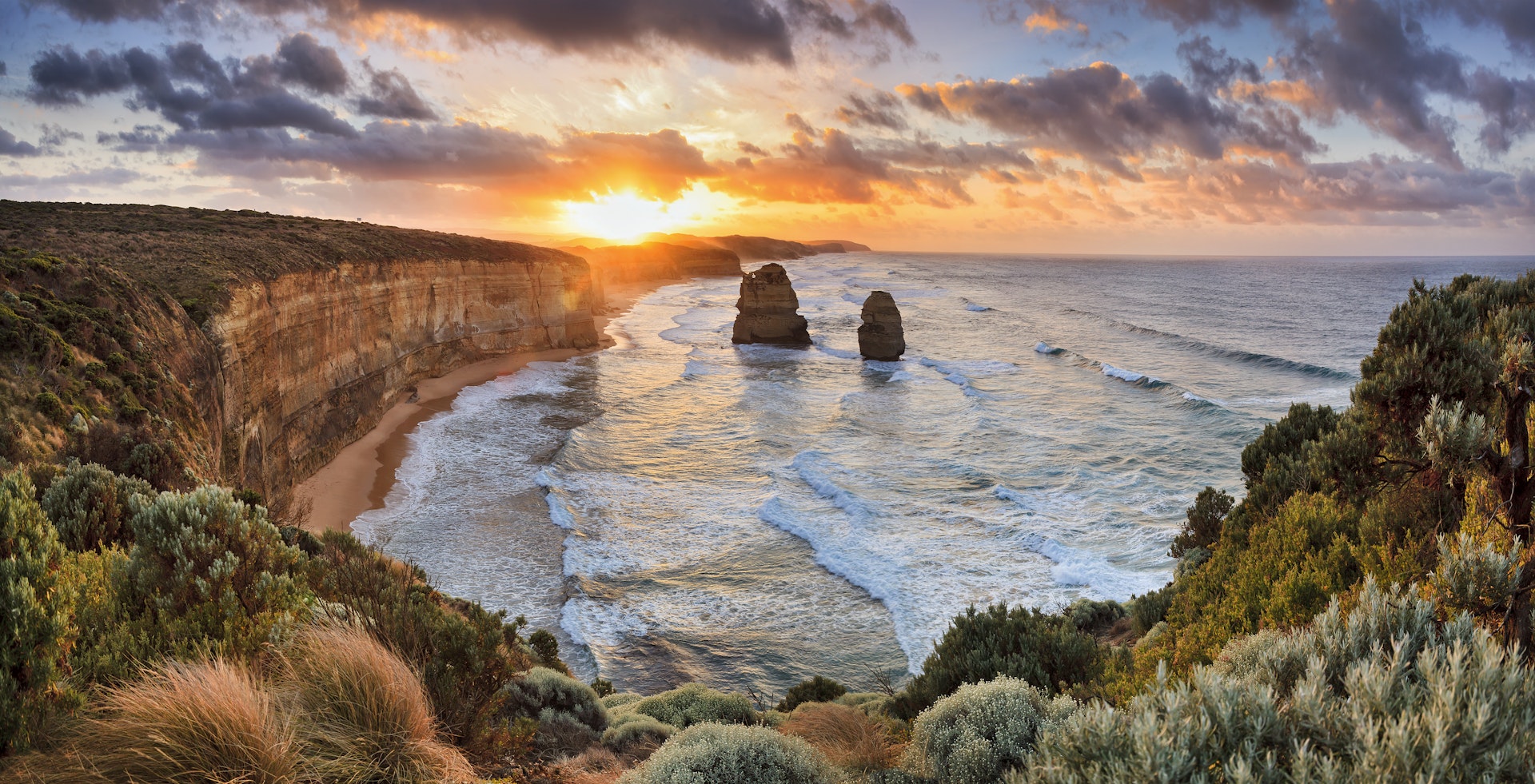 Two of Twelve Apostles rock formations in sea, Great Ocean Road at sunset