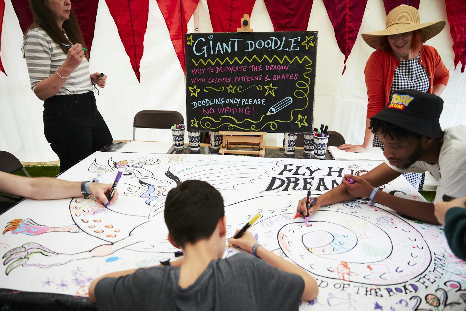 View of people creating in a tent at the End of the Road Festival in 2023