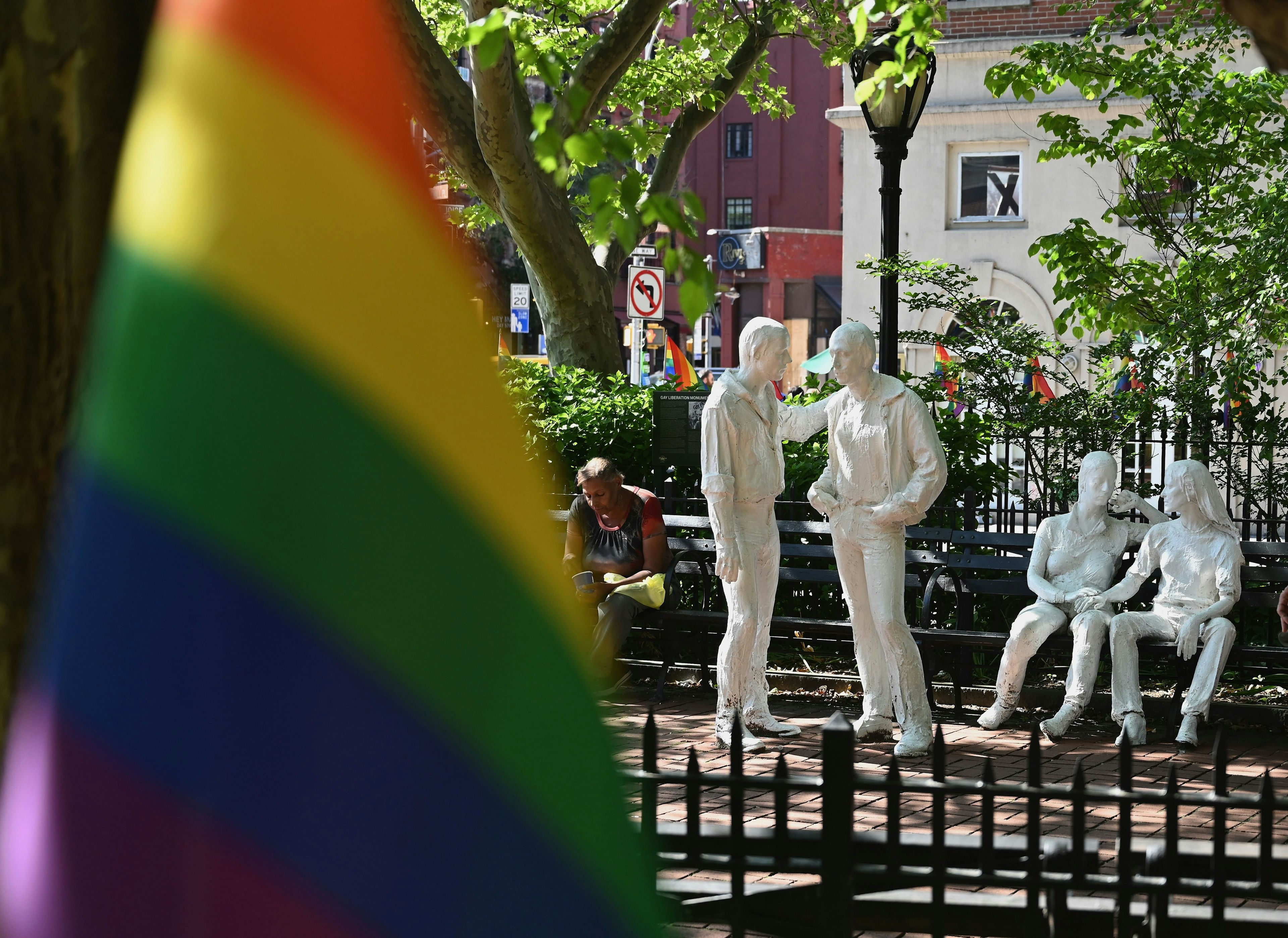 Rainbow flags and sculptures are seen at the Stonewall National Monument, West Village, New York City, New York, USA