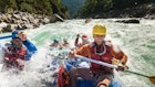 Rafters get splashed as they go through some big rapids on the Karnali river in Nepal - stock photo
The Karnali river in west Nepal is one of the wildest rivers for rafting and kayaking in the world with some Grade 5 rapids