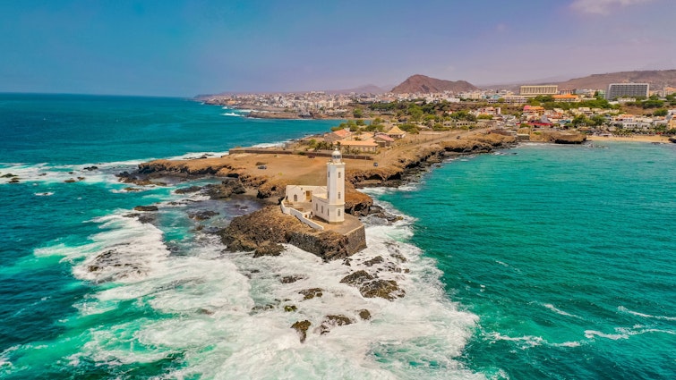 An aerial view of the shore of Praia de Santiago and the Praia lighthouse on a sunny day
1460448451
aerial, shore, coast, view, scenic, turquoise, santiago, landscape