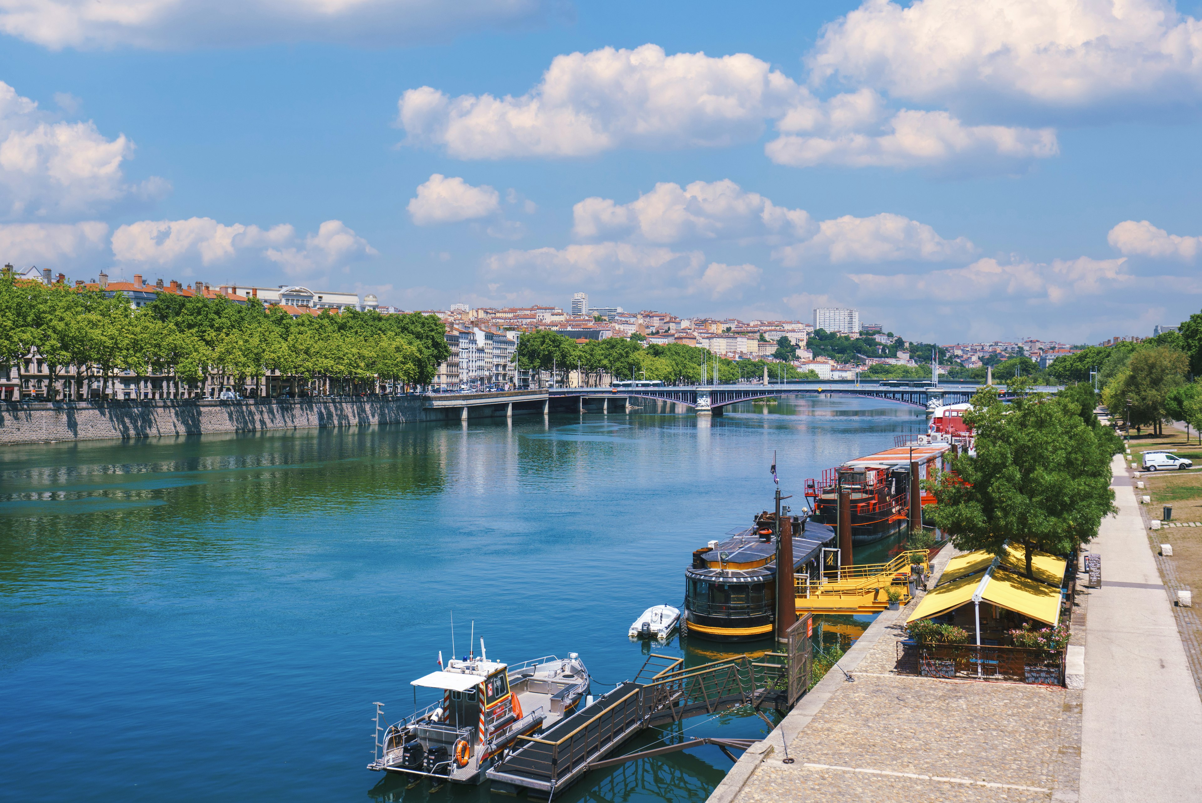 An aerial view of the Rhone River in Lyon, France on a sunny afternoon