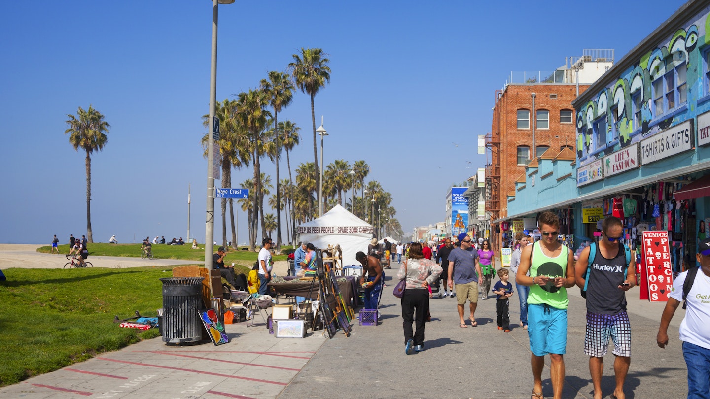 Venice Beach, Los Angeles, USA- February 23, 2014: Tourists and locals along the famous Venice Beach promenade.