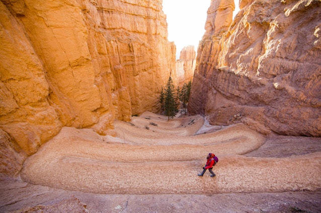 A person walking along a switchback trail in Bryce Canyon National Park, Utah