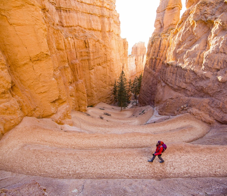 A person walking along a switchback trail in Bryce Canyon National Park, Utah