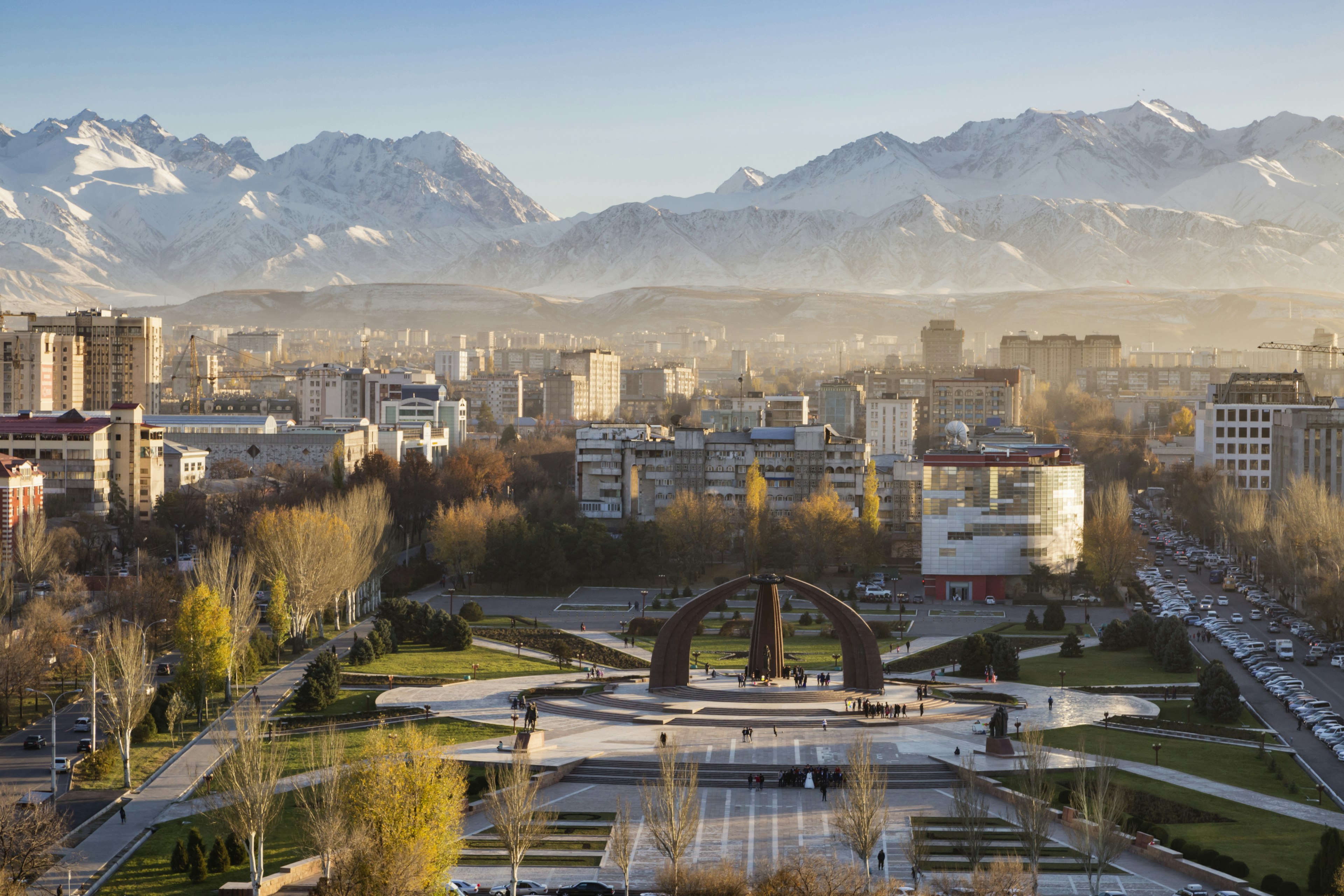 A city square with distant mountains