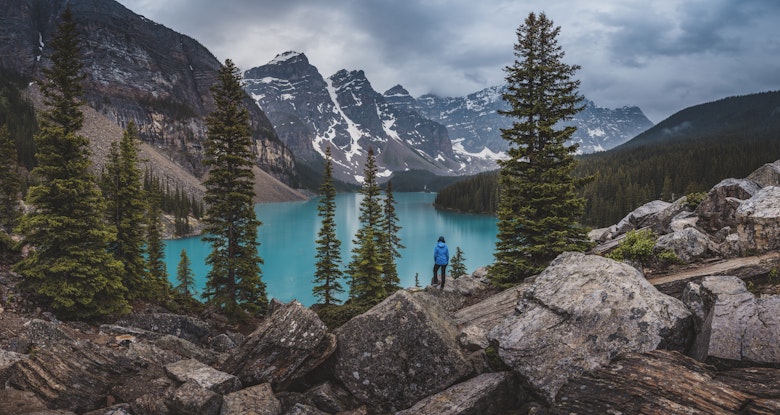 Hiker stands on top of rocks near Moraine Lake with the Canadian Rockies in the background.
1087161748
Non-Urban Scene, Alberta, Beauty In Nature, Canadian Rockies, Wood, Incidental People, Banff National Park, Day, Canada, Mountain, Majestic, Lake, Woodland, Horizontal, Color Image, Photography, Nature, Outdoors, Scenics - Nature, Canada Place, Moraine Lake, Landscape - Scenery