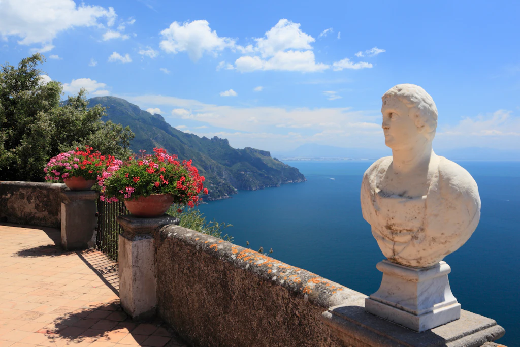 The Infinity Terrace at Villa Cimbrone A stone bust and flowers on the coastal terrace of Villa Cimbrone.