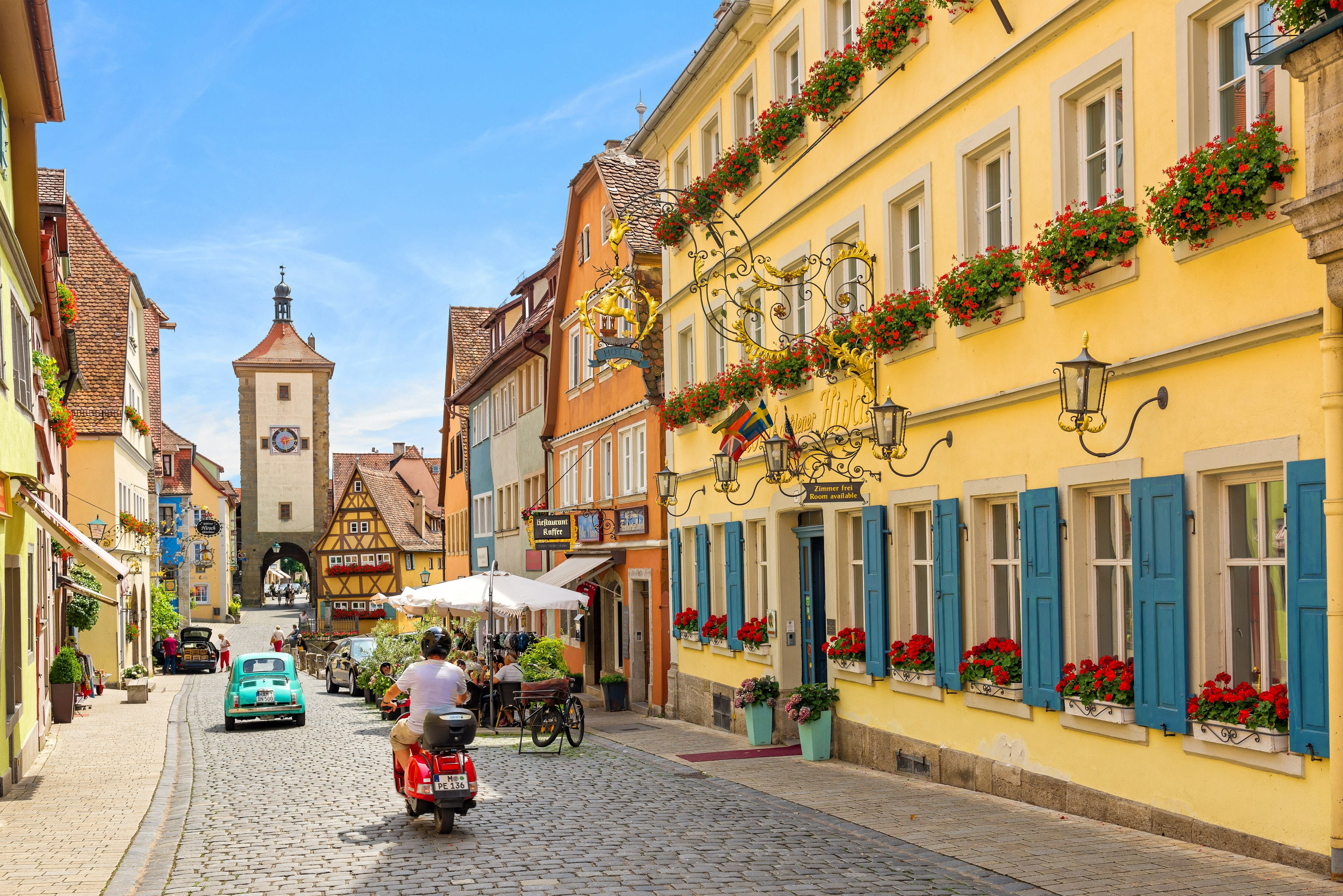 Schmiedgasse street in the historic old town of Rothenburg ob der Tauber during summer.