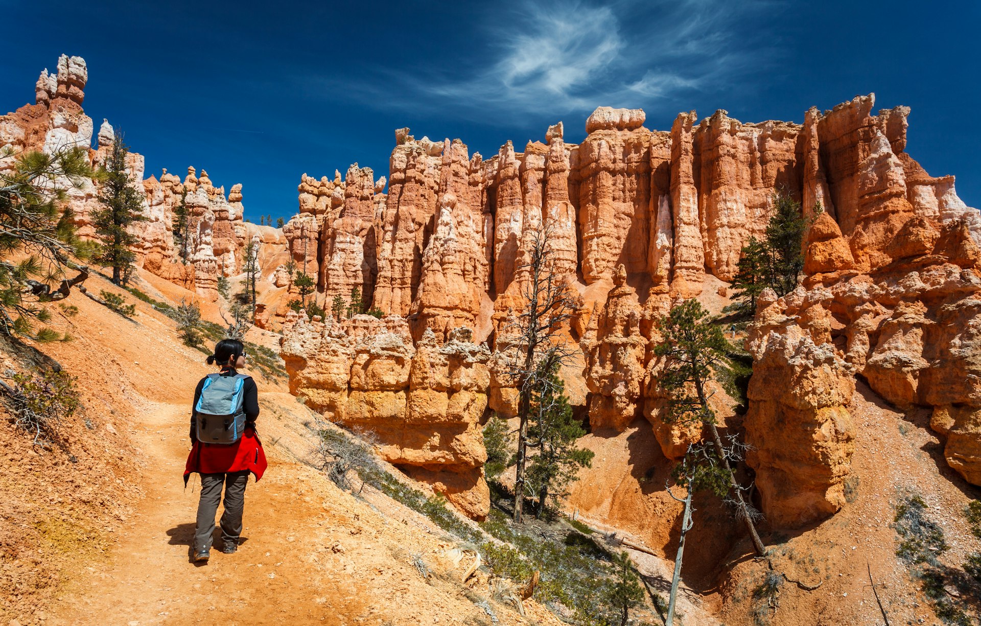 Female hiker walking on the Queens Garden Trail at Bryce Canyon National Park.
