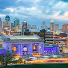 Kansas City lit up in the evening.
760264327
Night, Skyline, Skyscraper, Kansas City - Missouri, Built Structure, City, Building Exterior, Illuminated, Horizon, Kansas City, Photography, Cloud - Sky, Urban Skyline, USA, No People, Long Exposure, Travel Destinations, Horizontal, Cityscape, Architecture, Sky, Tree, Illumination, Modern, Color Image, Outdoors, Missouri