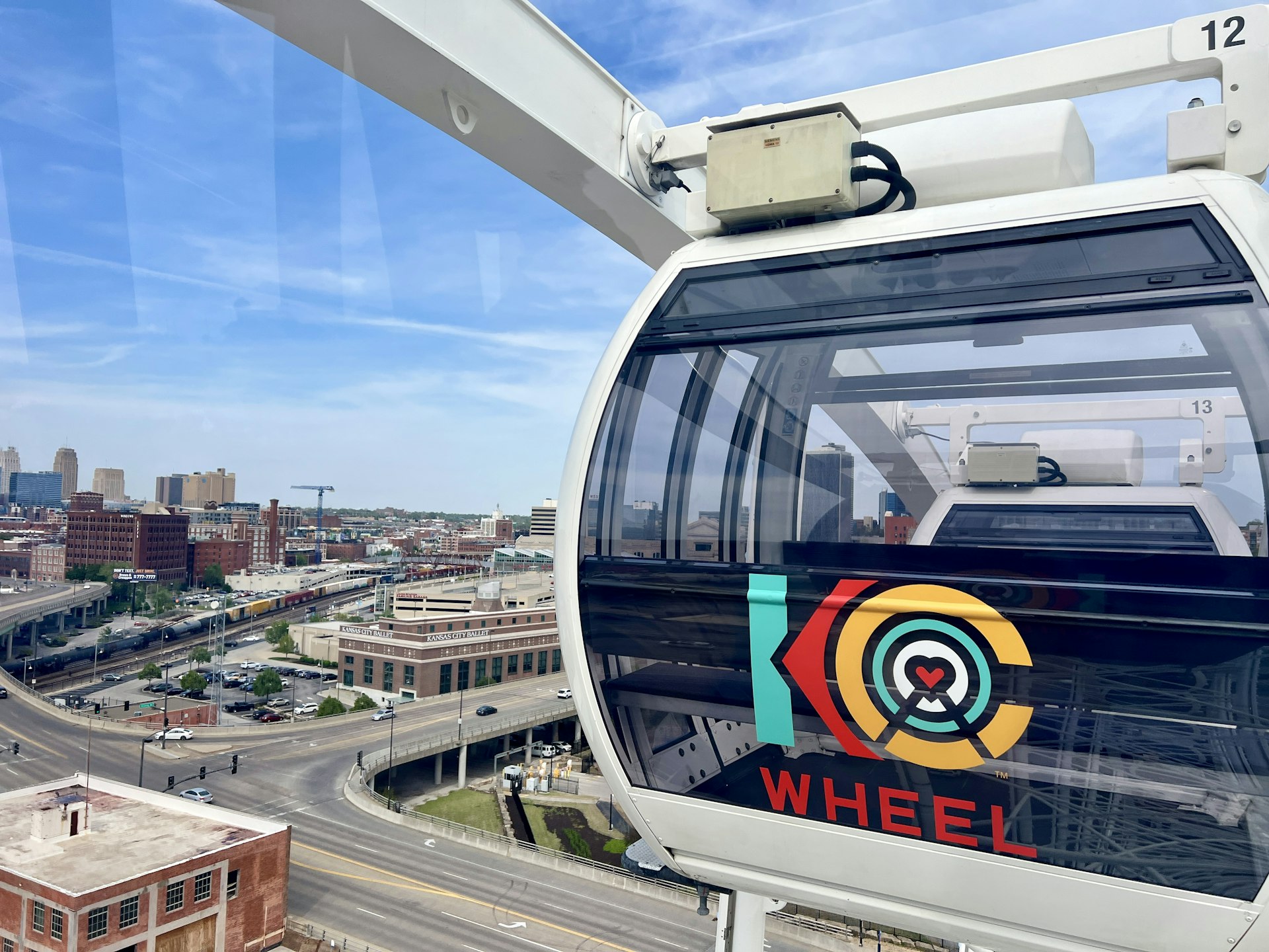 KC Wheel -- with a view of the city scape and another carriage