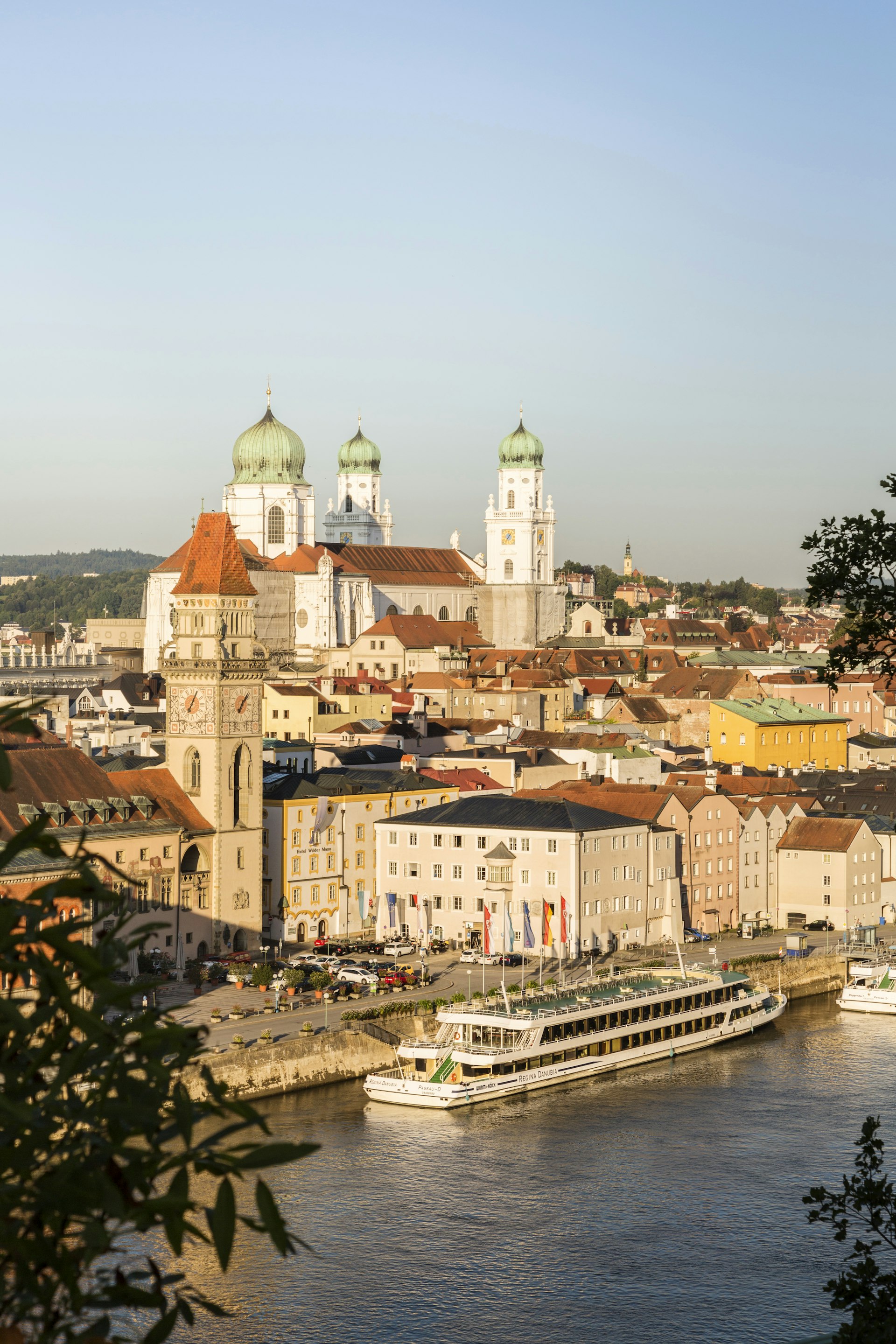 Sunset's golden light signs on the Italianite city of Passau and the Danube river.