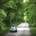 Writers Christa Larwood and Oliver Smith on country road following trail led by Lonely Planet founders 40 years prior.
Issue 57, acrosstheplanet, Lonely Planet Traveller Magazine