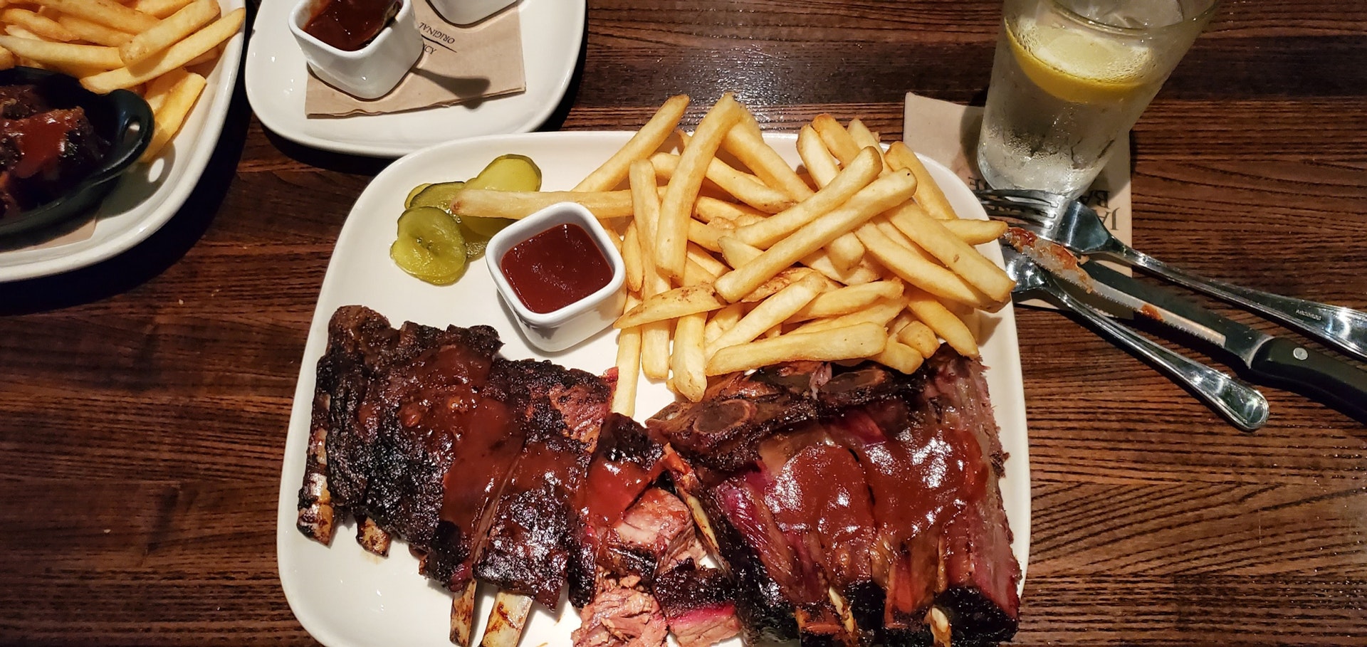 Kansas City pit masters barbecue ribs, brisket, pork and chicken slathered with sauces.